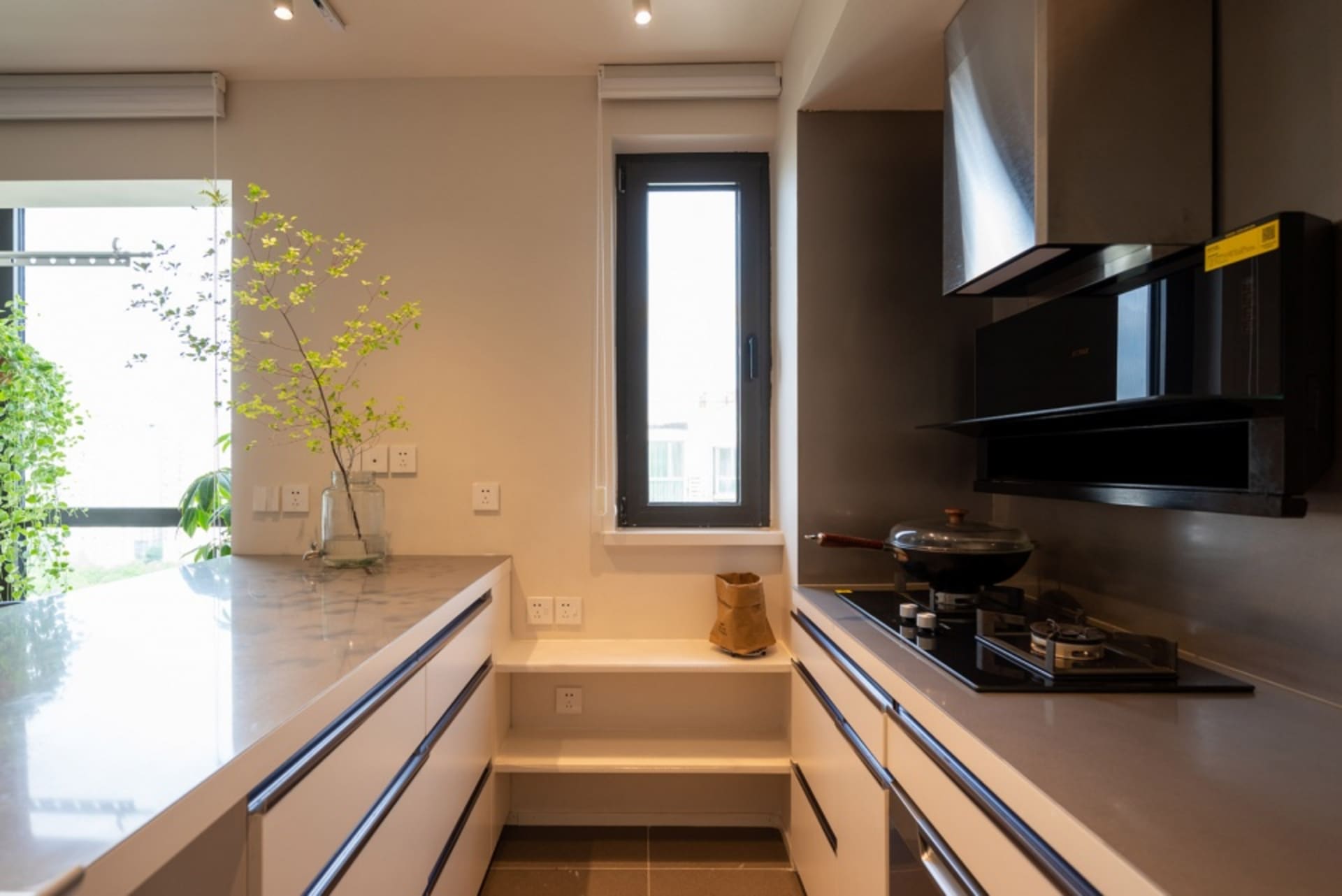 Modern kitchen with marble countertops and minimalist design features