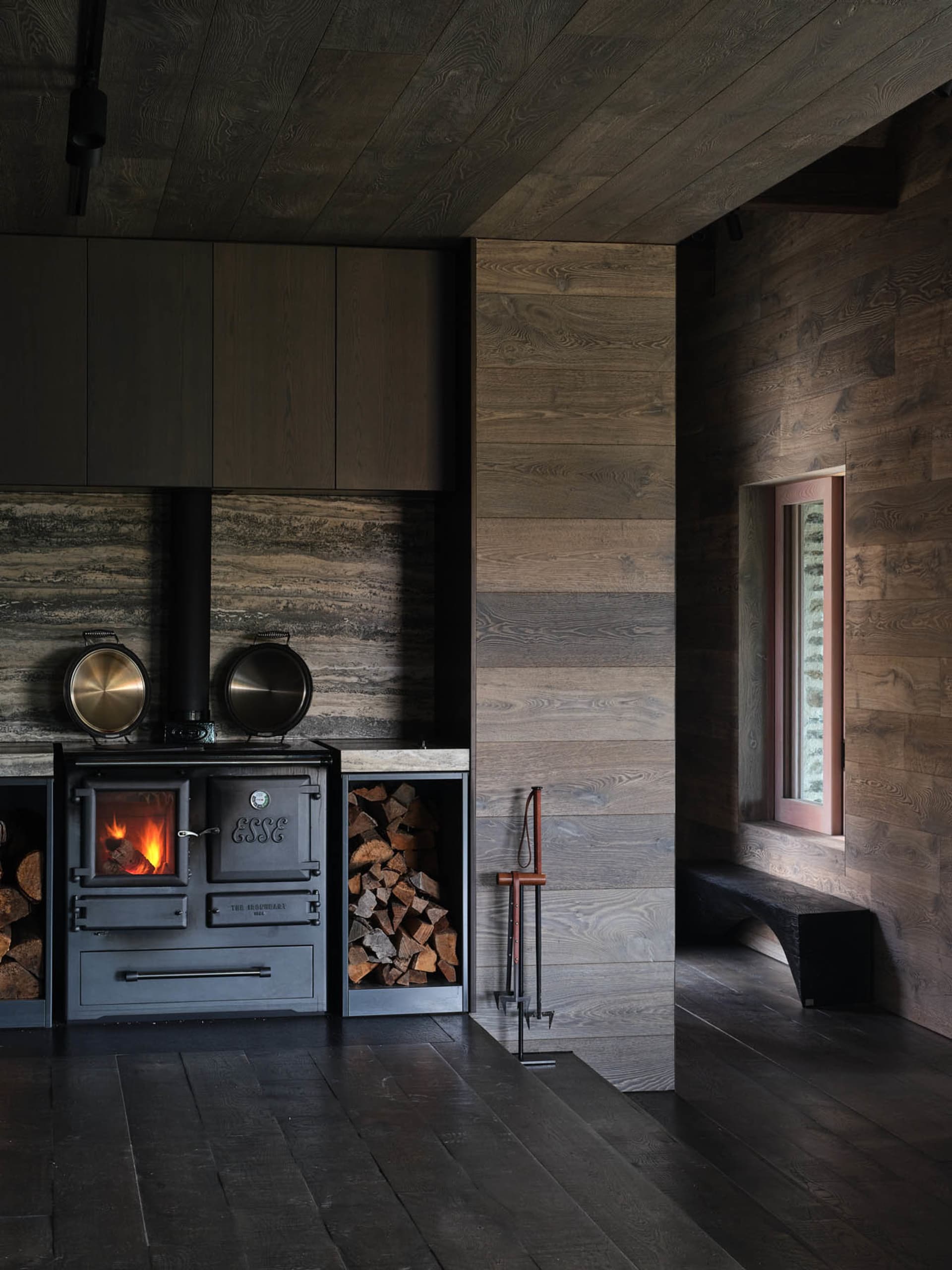 Industrially styled kitchen with metal stove and wood accents