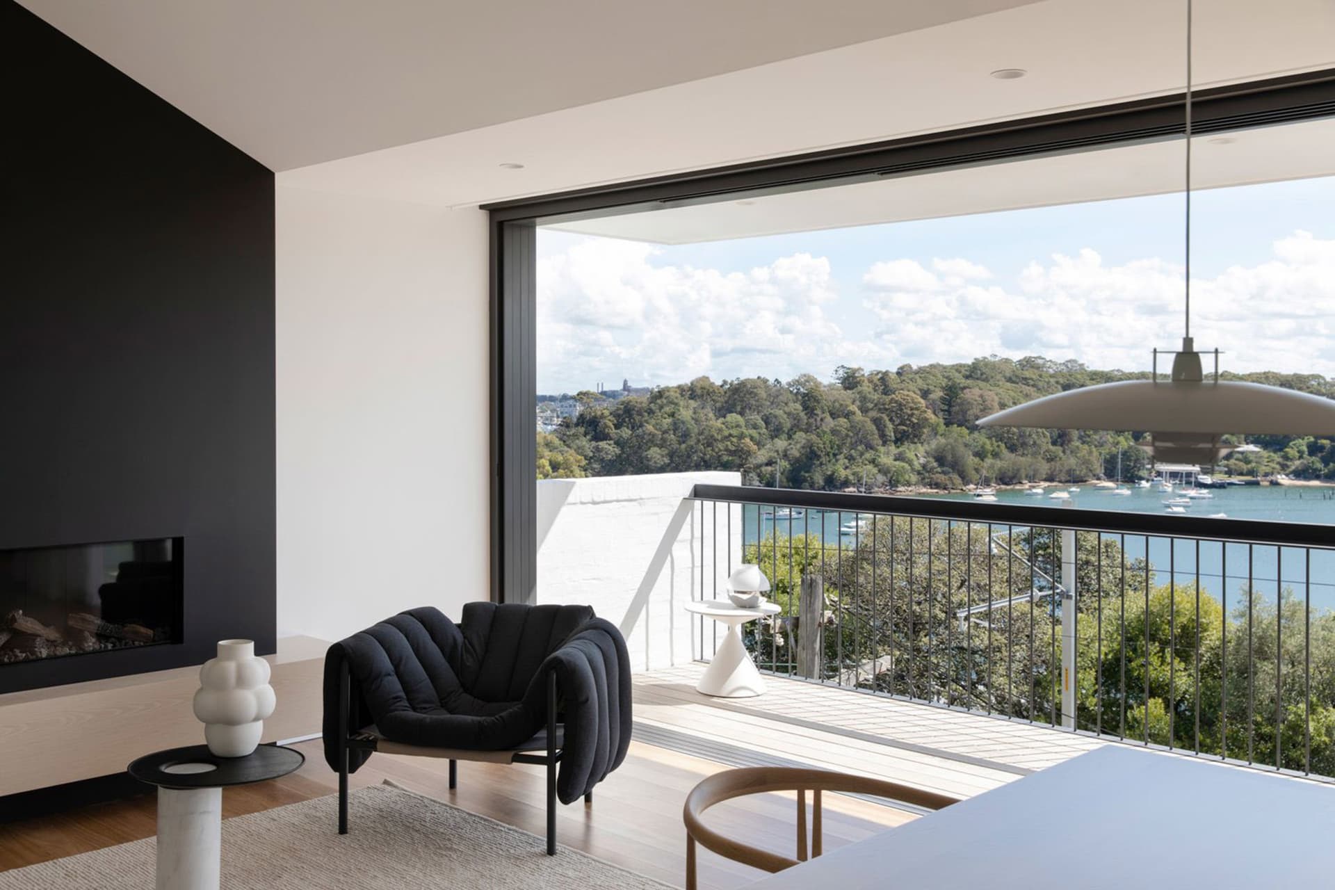 A modern minimalist living room featuring wooden elements.