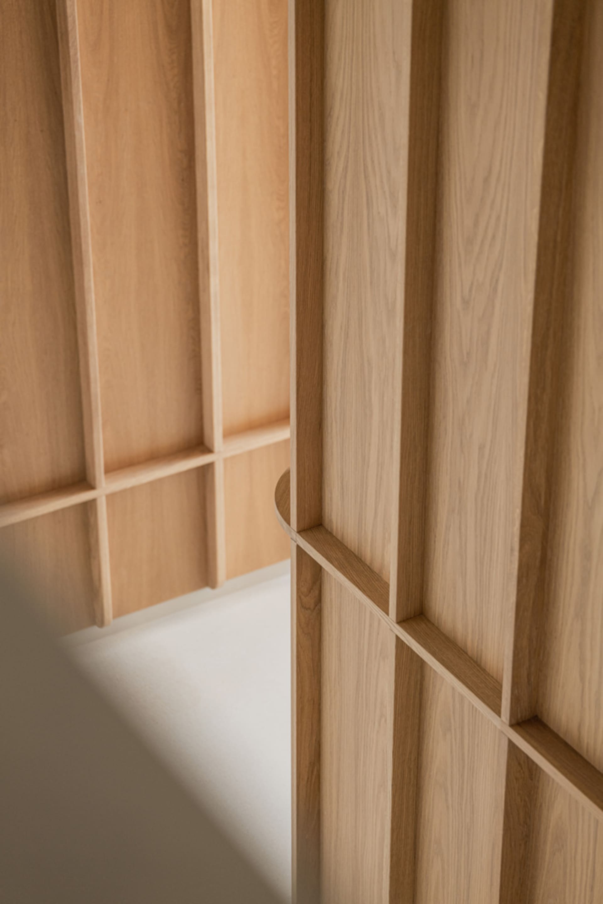 A modern wooden closet interior with clean lines and minimalist design.