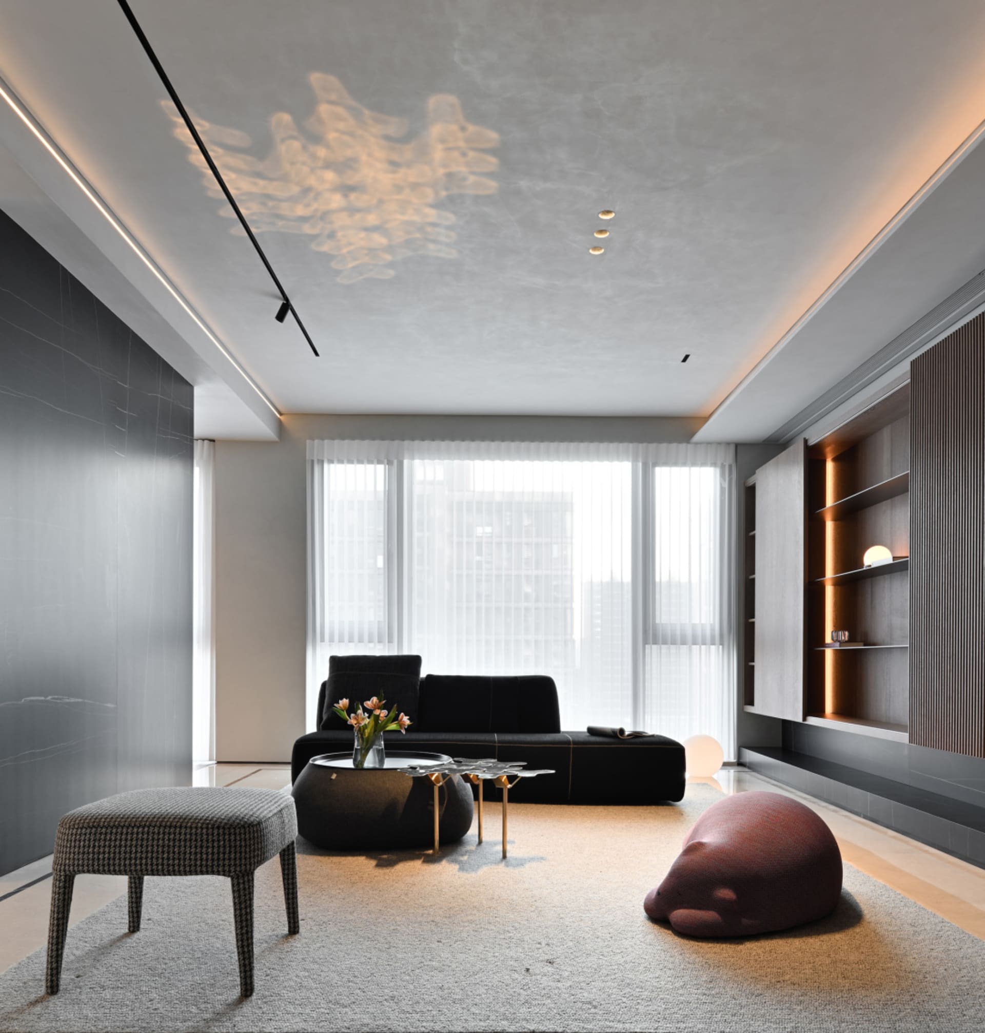 Comfortable minimalist living room with modern furniture and neutral tones.