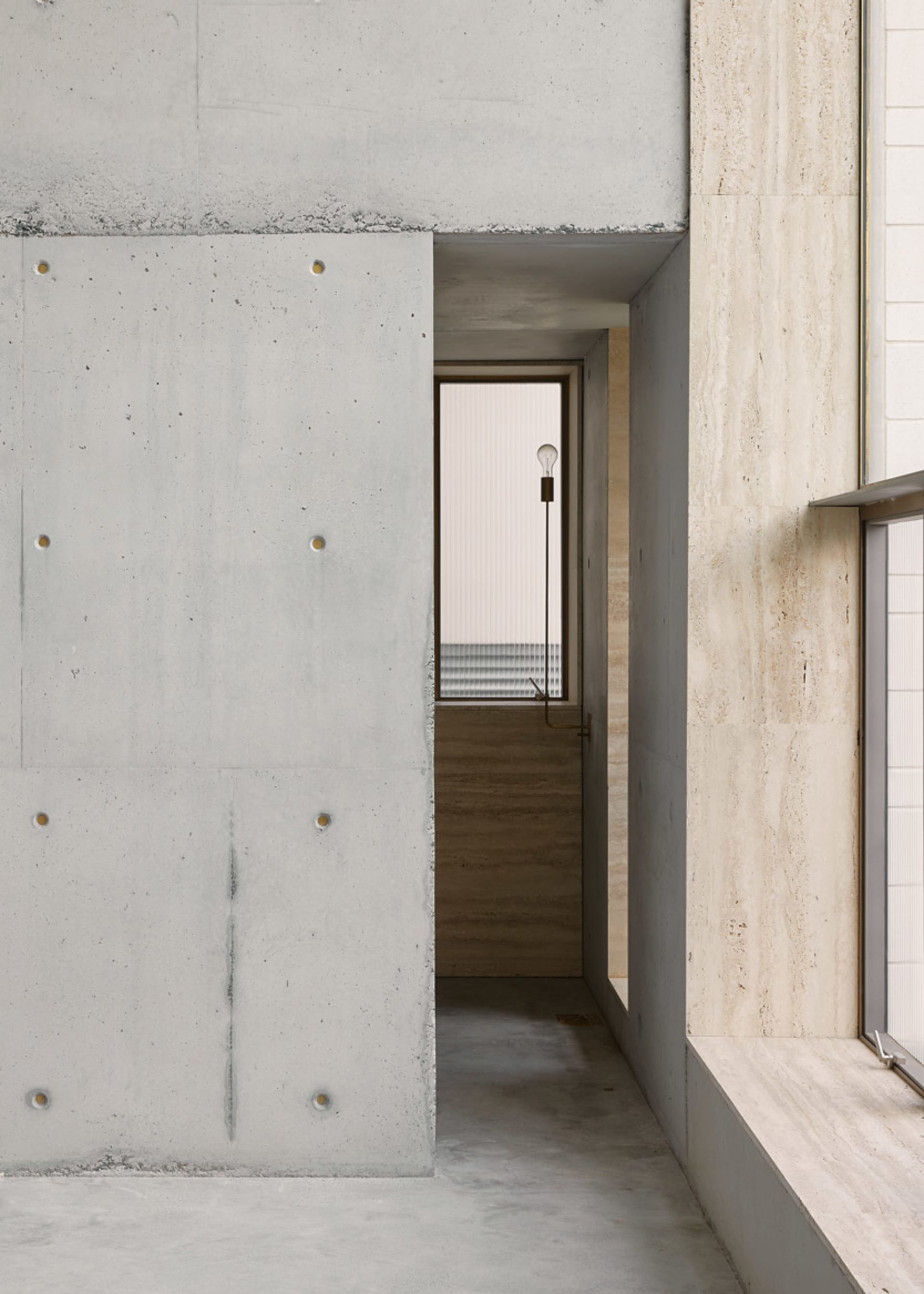 Modern interior with concrete walls and minimalist design elements.