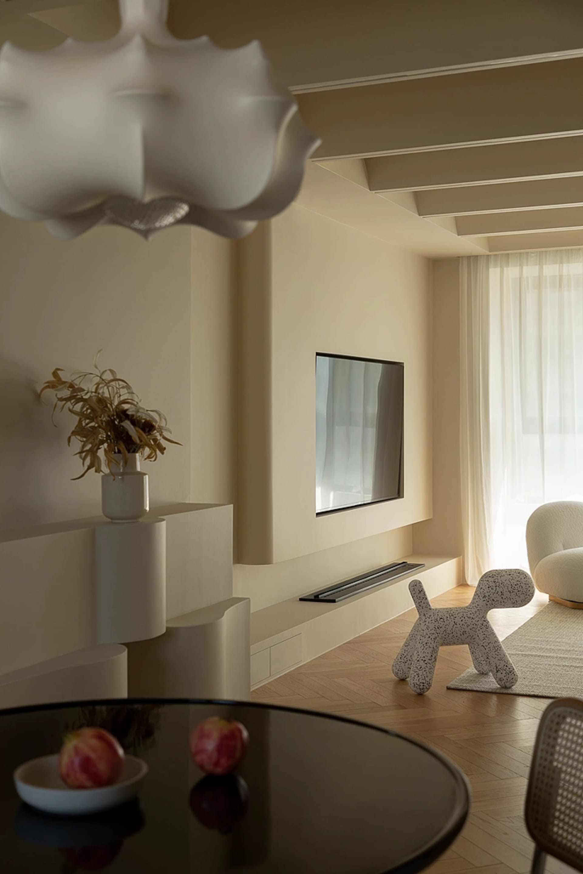 A minimalist living room with modern materials and a sleek, contemporary design.