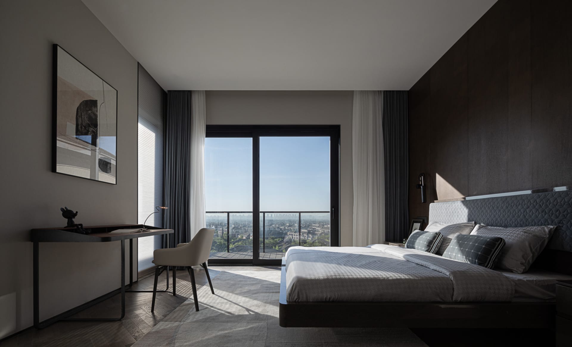 Modern, minimalist bedroom featuring a sofa and marble surface.