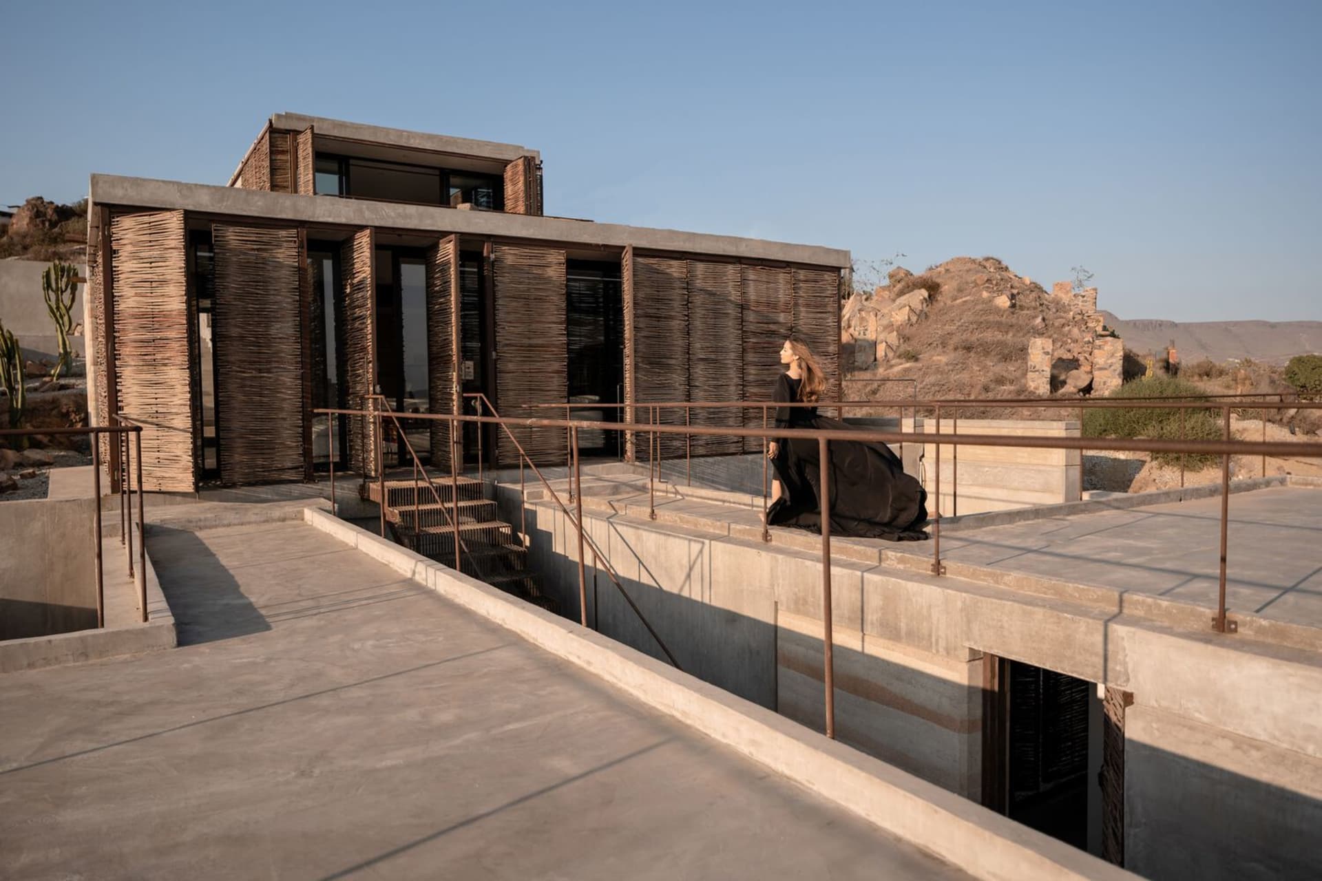 A modern residential interior designed with concrete materials.