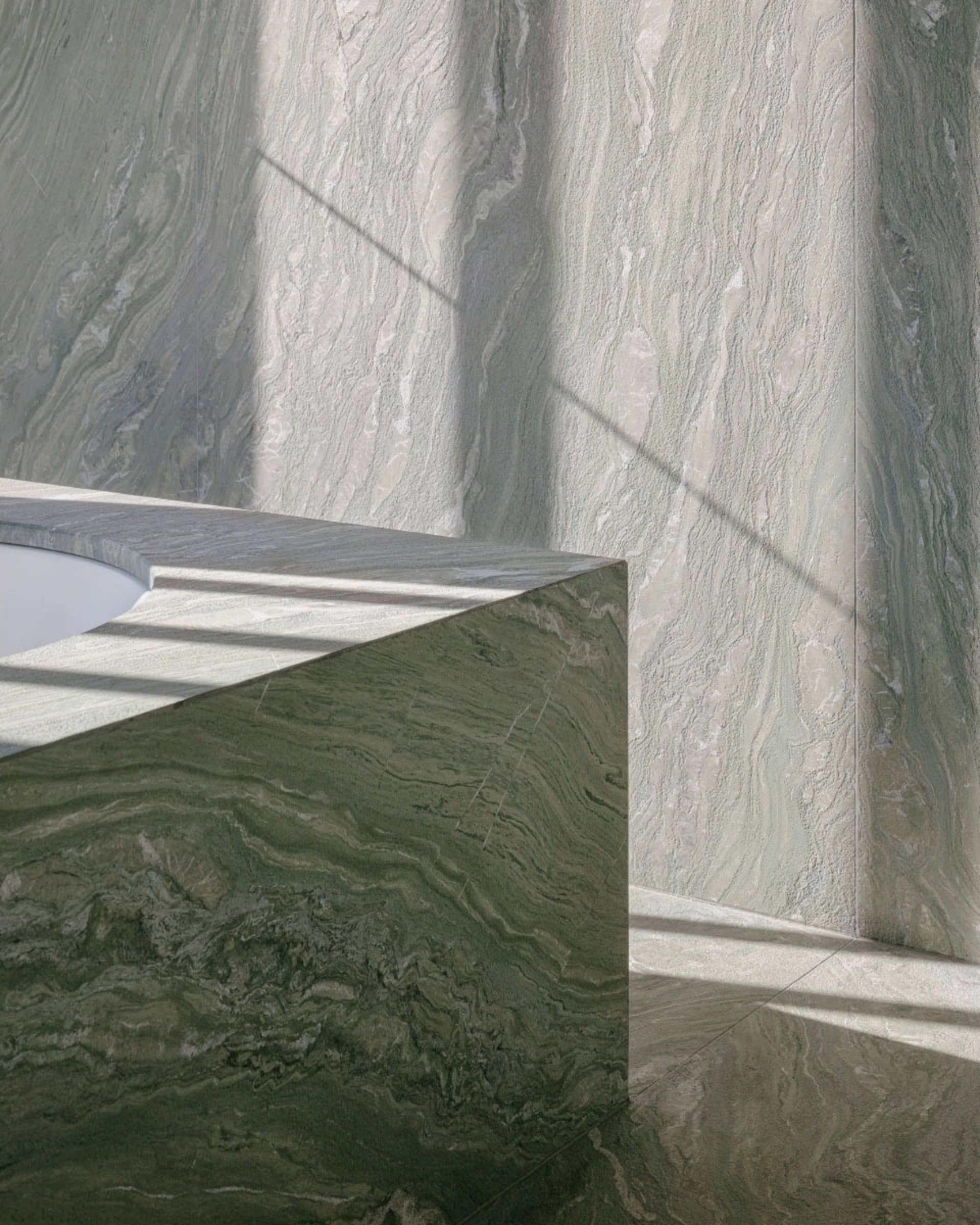 A modern bathroom with marble walls and floor.