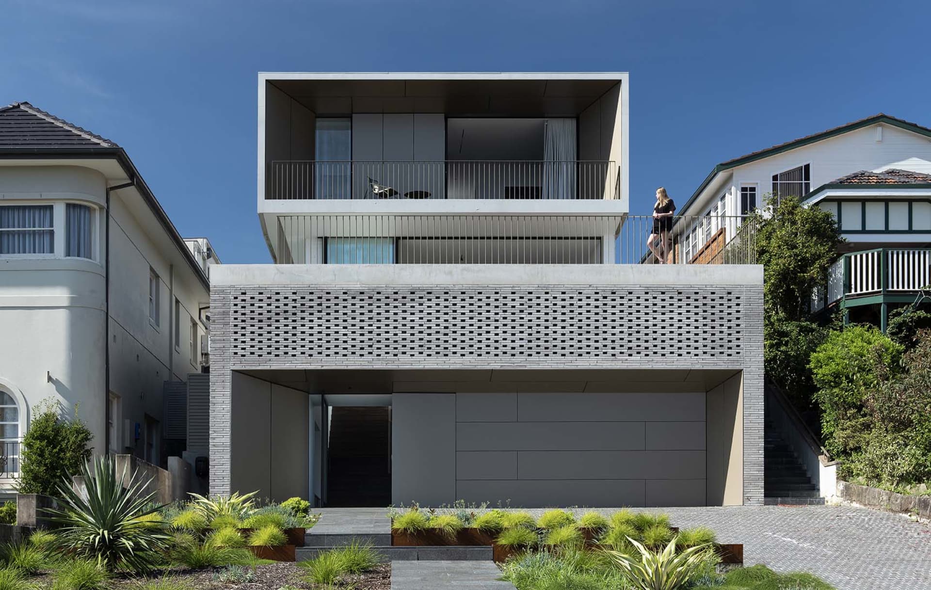 Modern, rectangular concrete architectural object with a flat roof and minimalist design.