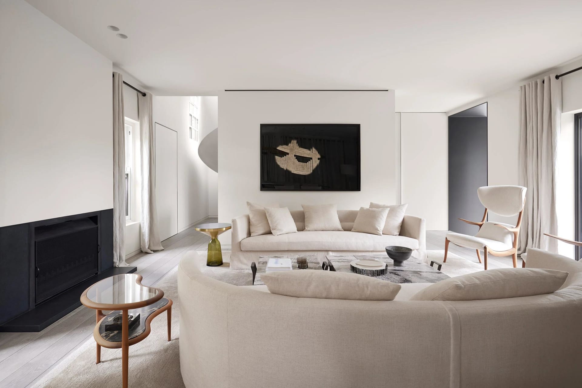 White living room with modern furniture and minimalist decor.