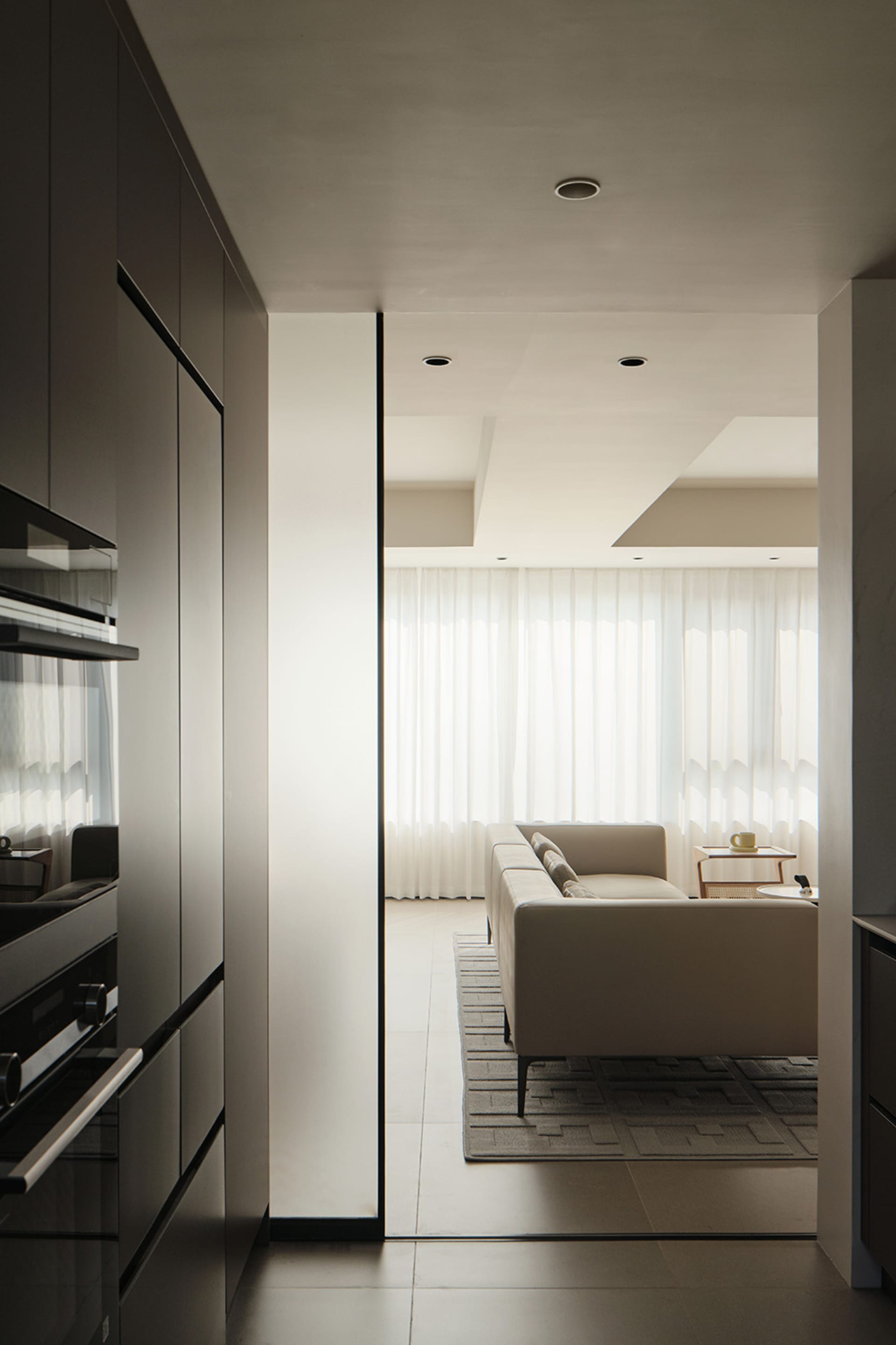 A modern interior design living room featuring white curtains.
