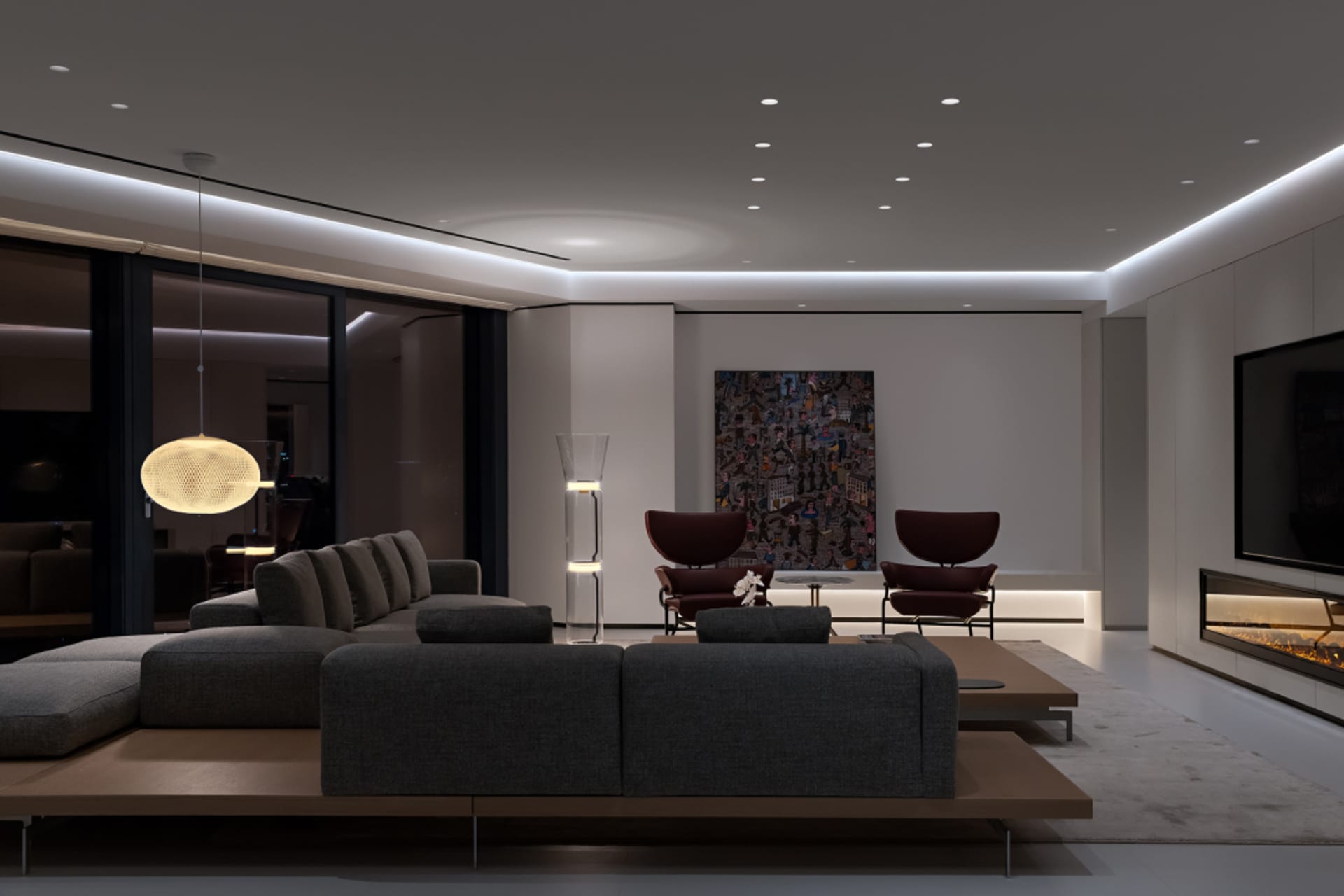 Modern living room featuring metallic accents, glass elements, and fabric seating.