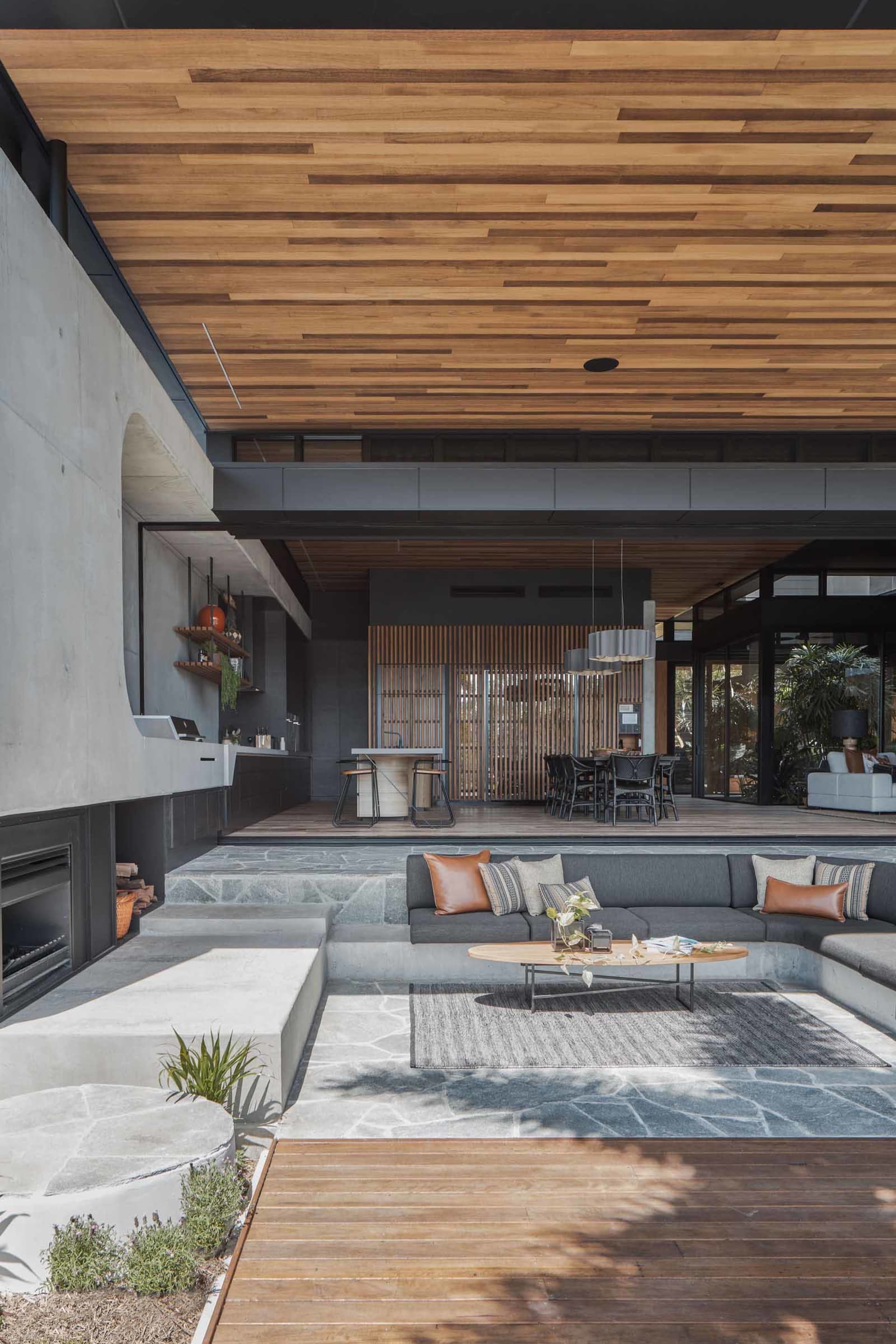 A modern industrial living space featuring concrete and wood materials.