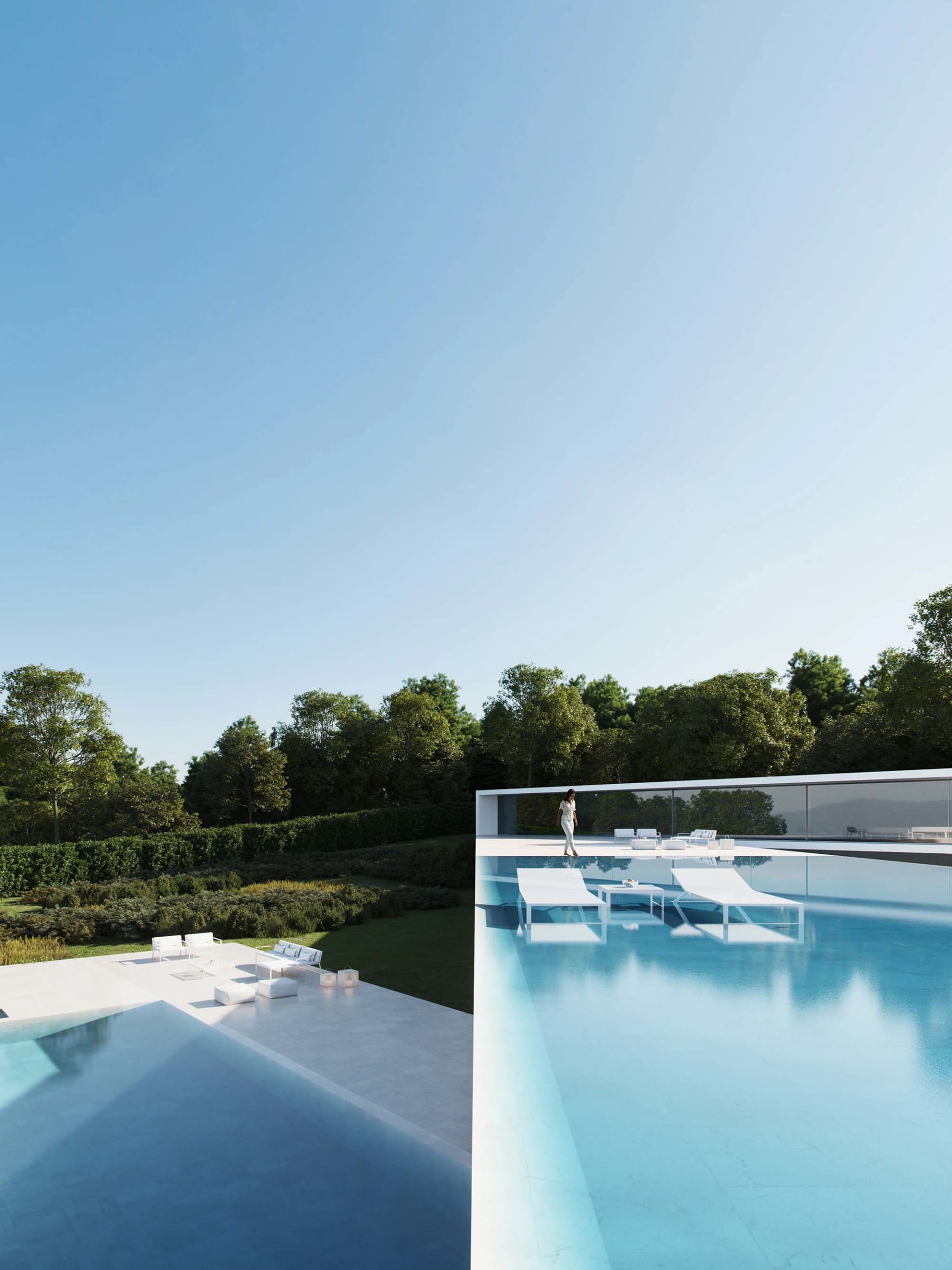 Contemporary residential area featuring glass walls and open design.