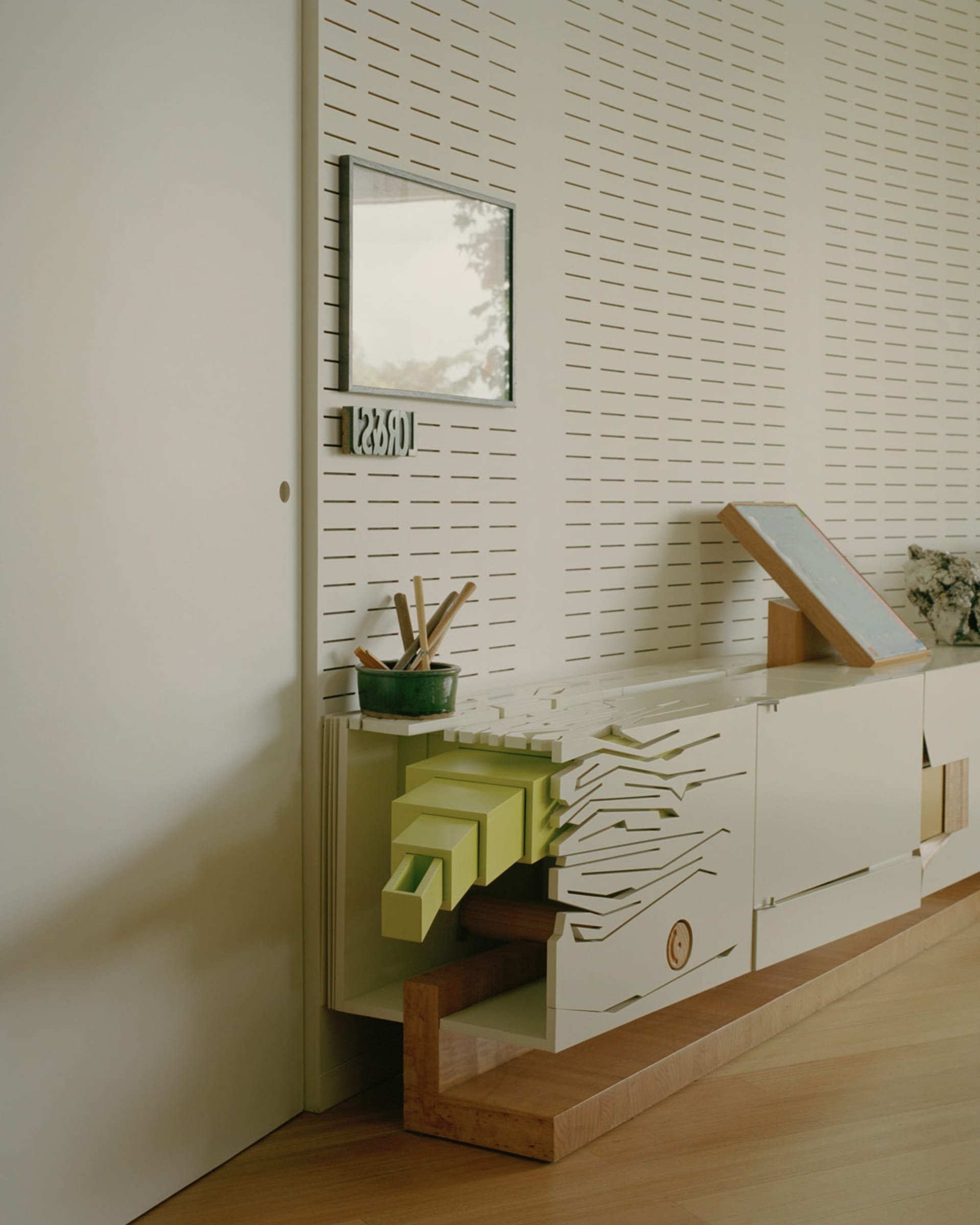 Minimalist furniture with wood and glass materials, featuring a sleek and modern design.