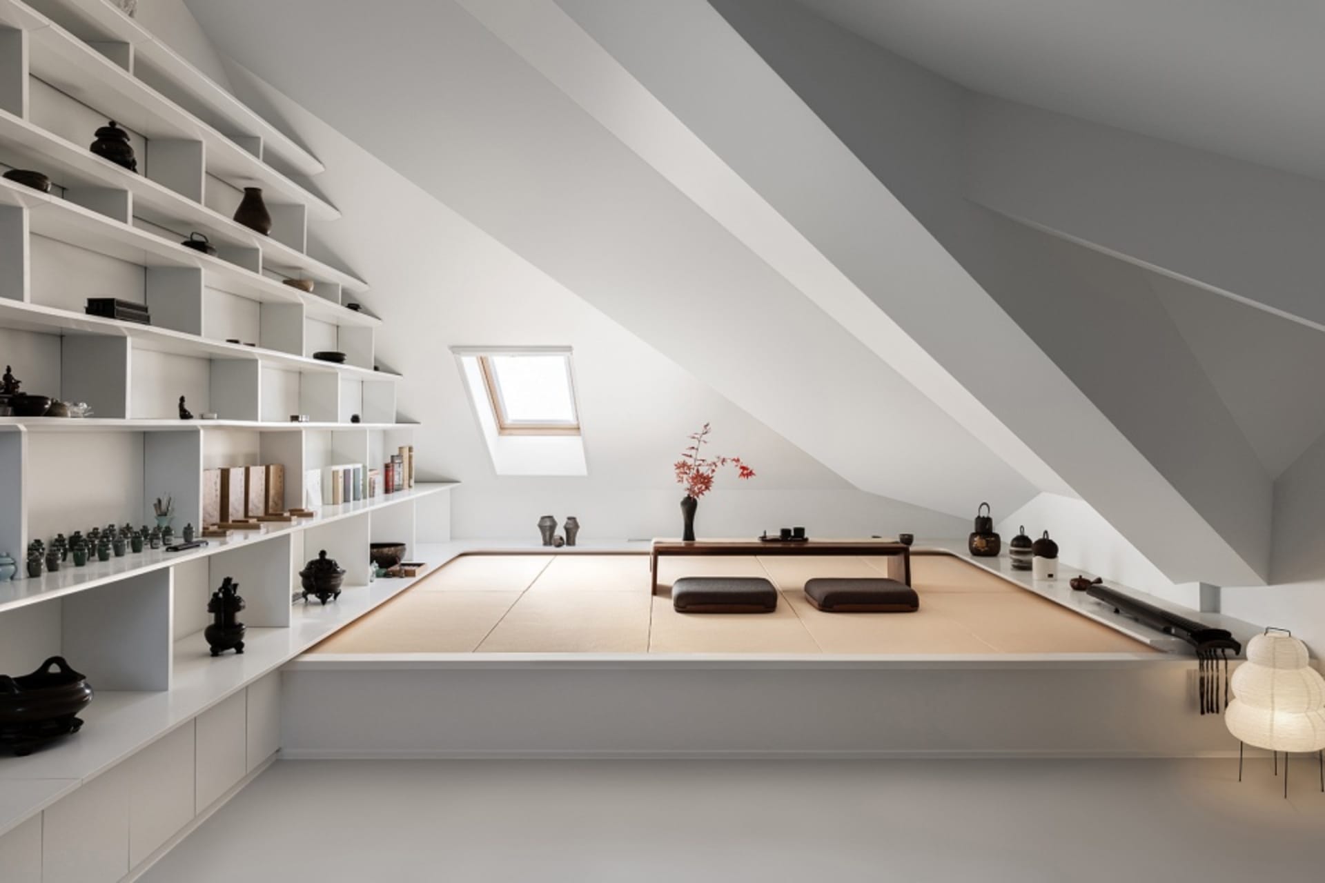 A minimalist living space with white walls, wooden accents, and a tatami-style floor.
