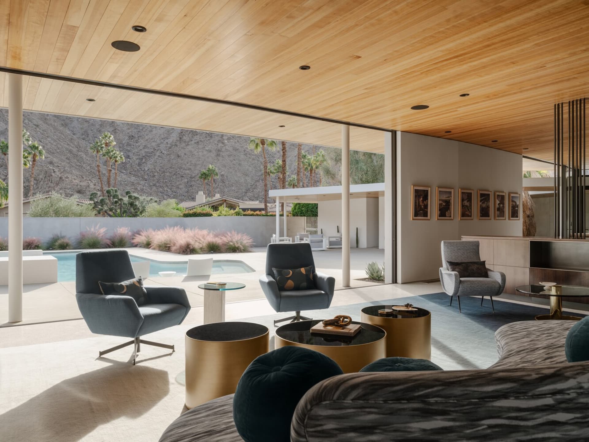 Modern living room featuring metal, glass, and wood materials.