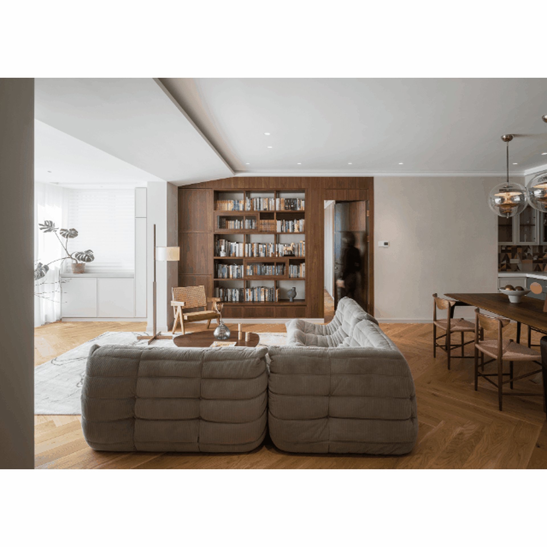 A modern residential space featuring wooden furniture and a cozy atmosphere.