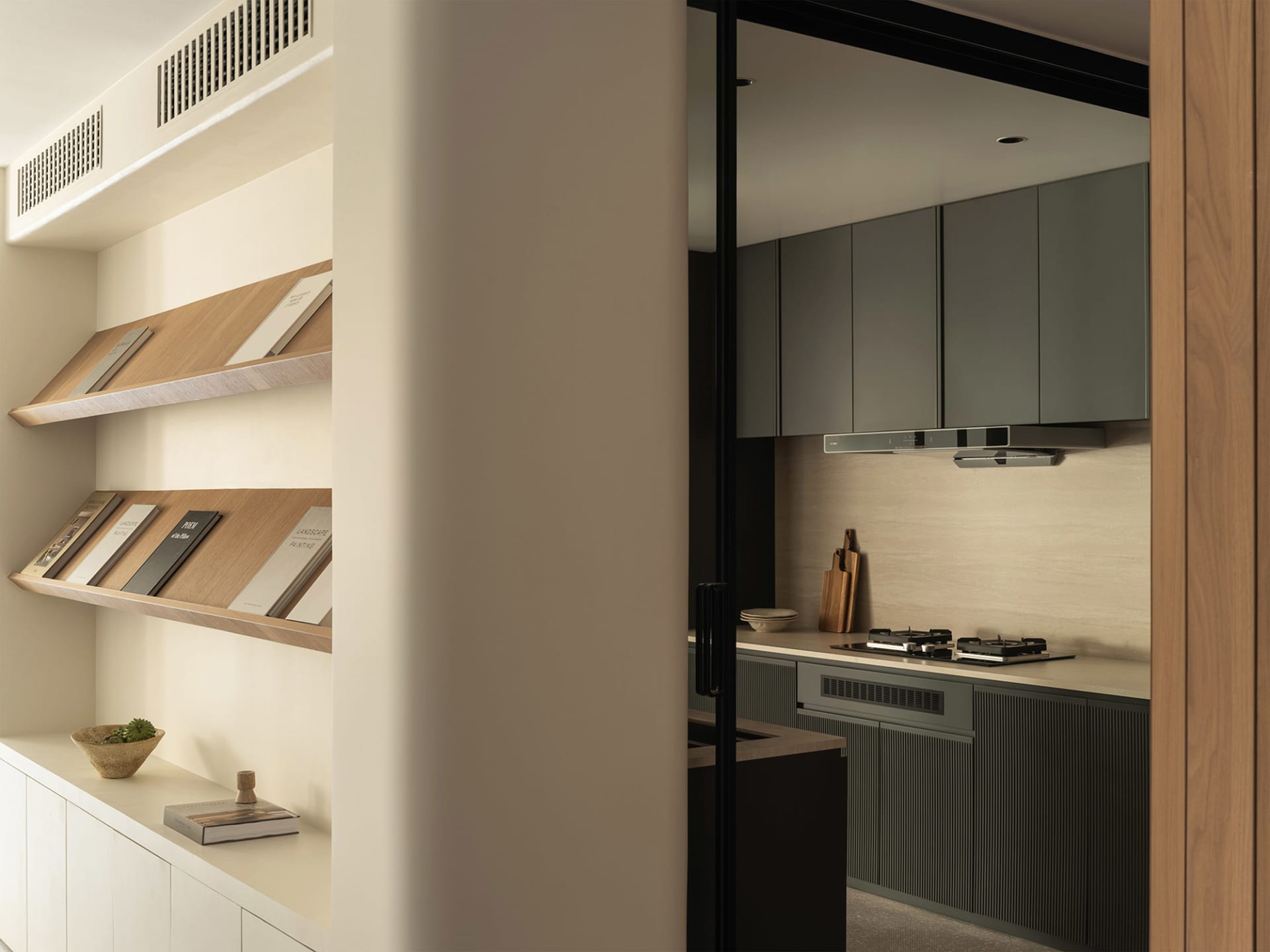 A modern residential kitchen featuring wooden cabinets and a stone backsplash.
