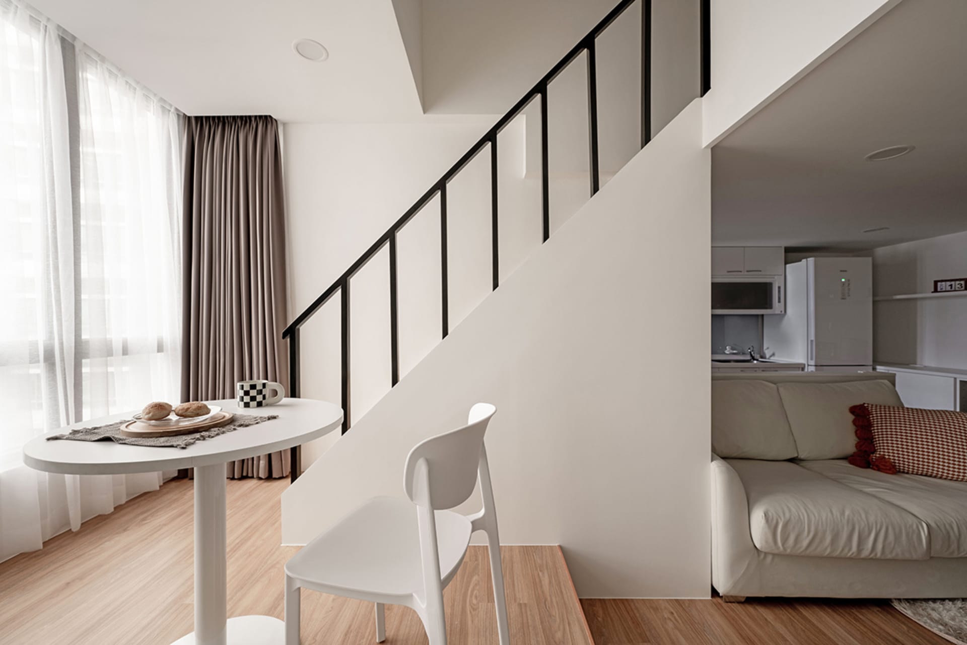 Modern living room featuring neutral colors and minimalist design.