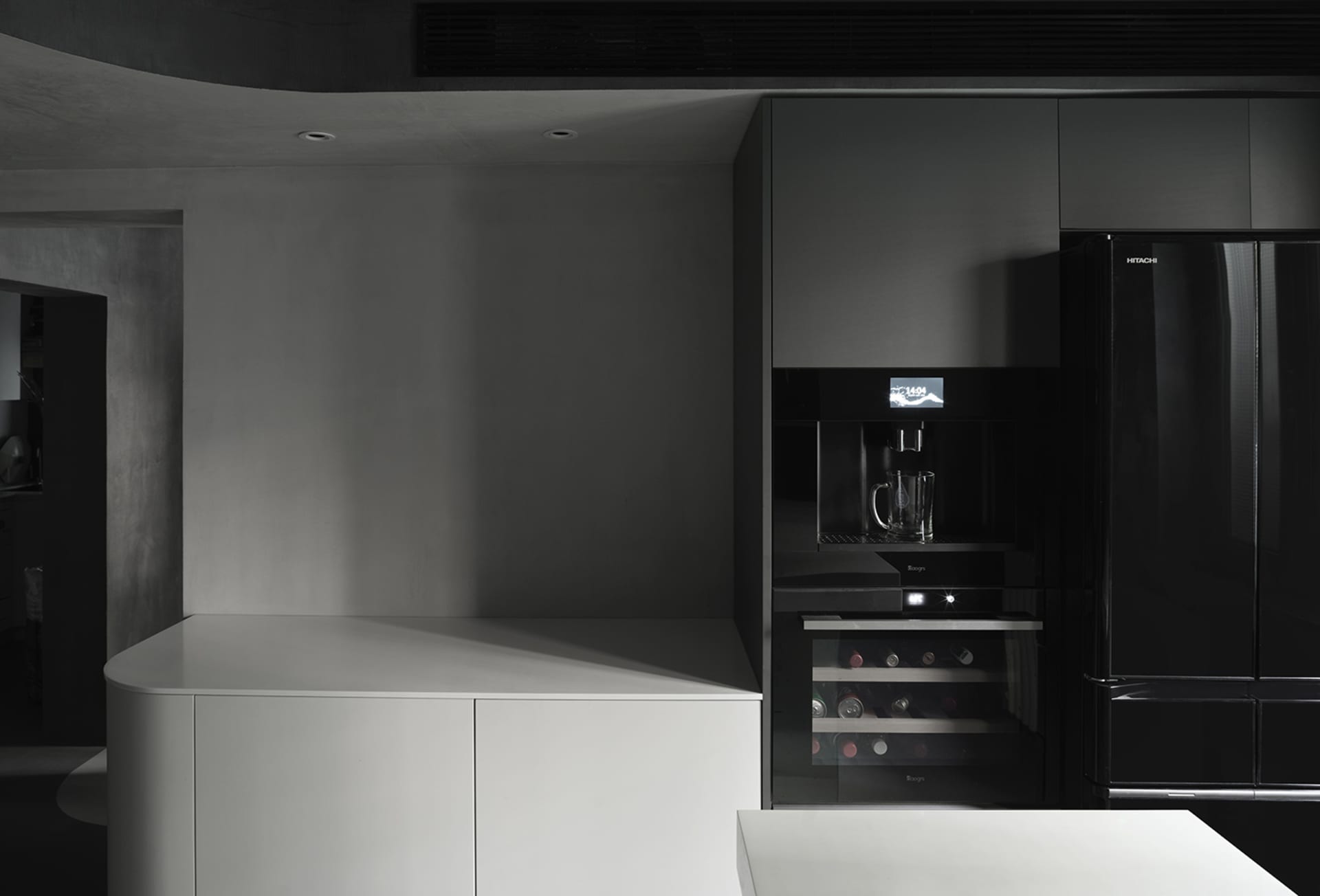 A modern kitchen space featuring black and white color scheme.