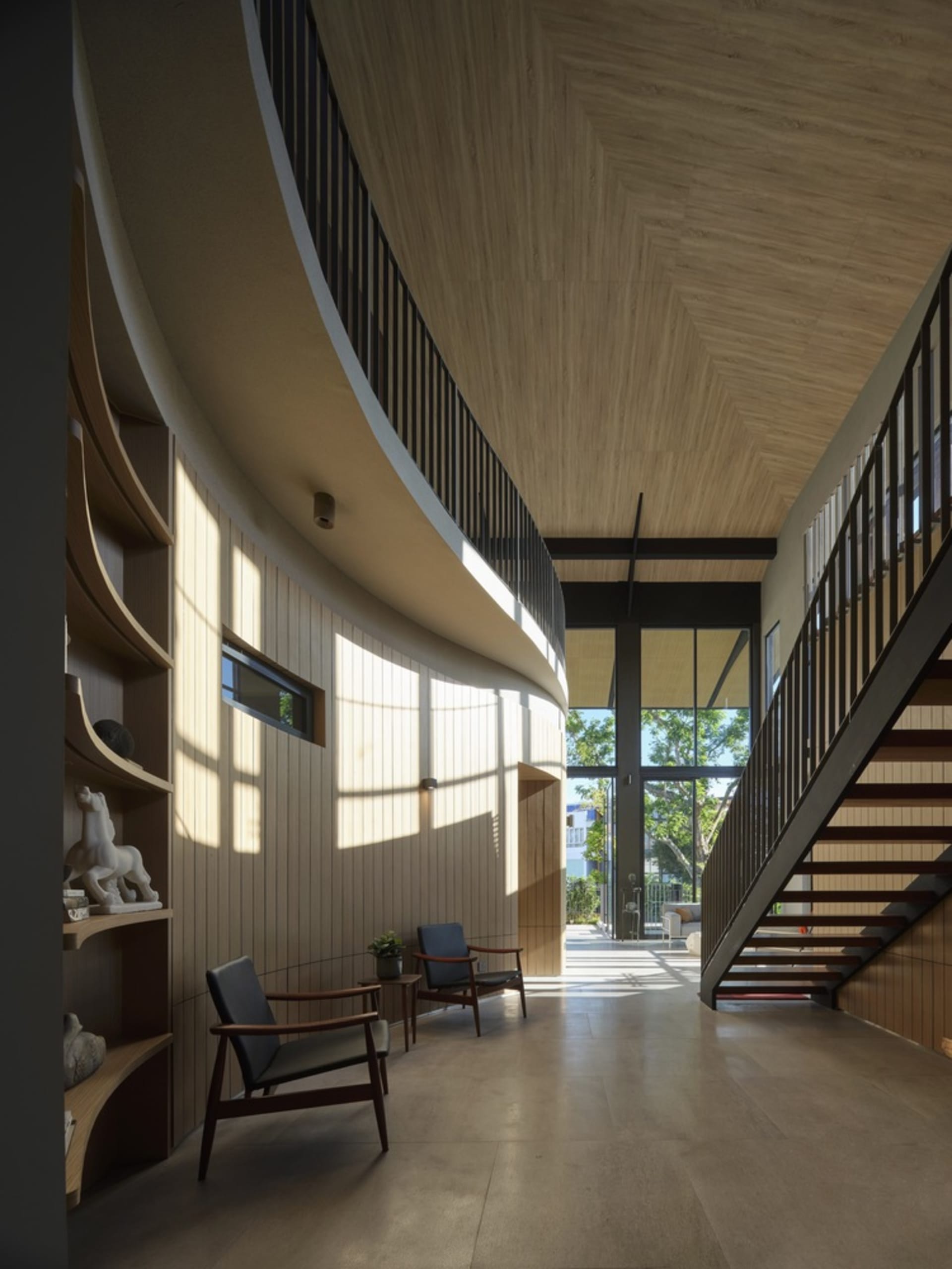 A modern interior with wooden walls and floors, featuring an open space and stairs.