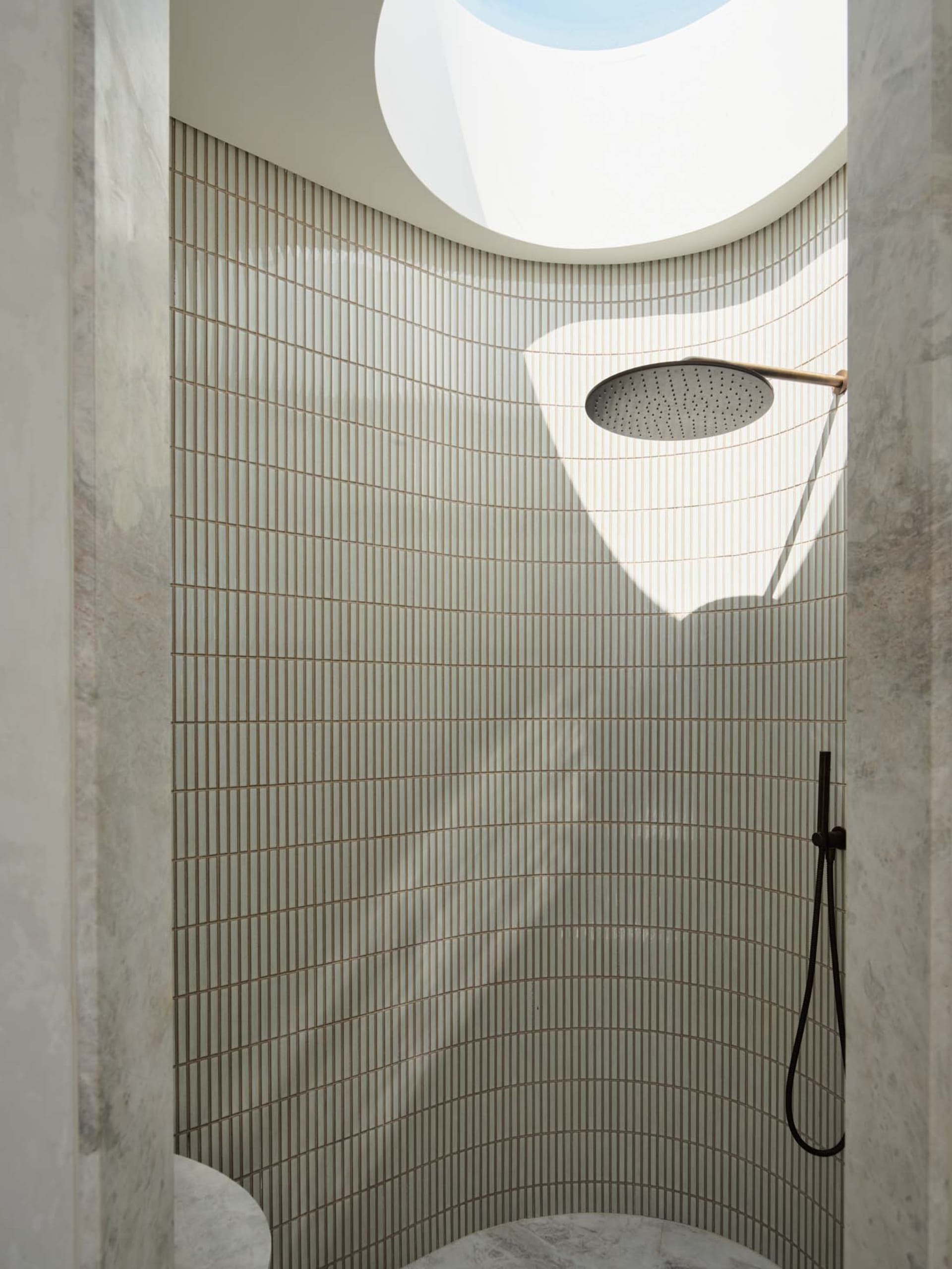 Modern bathroom with marble and glass materials
