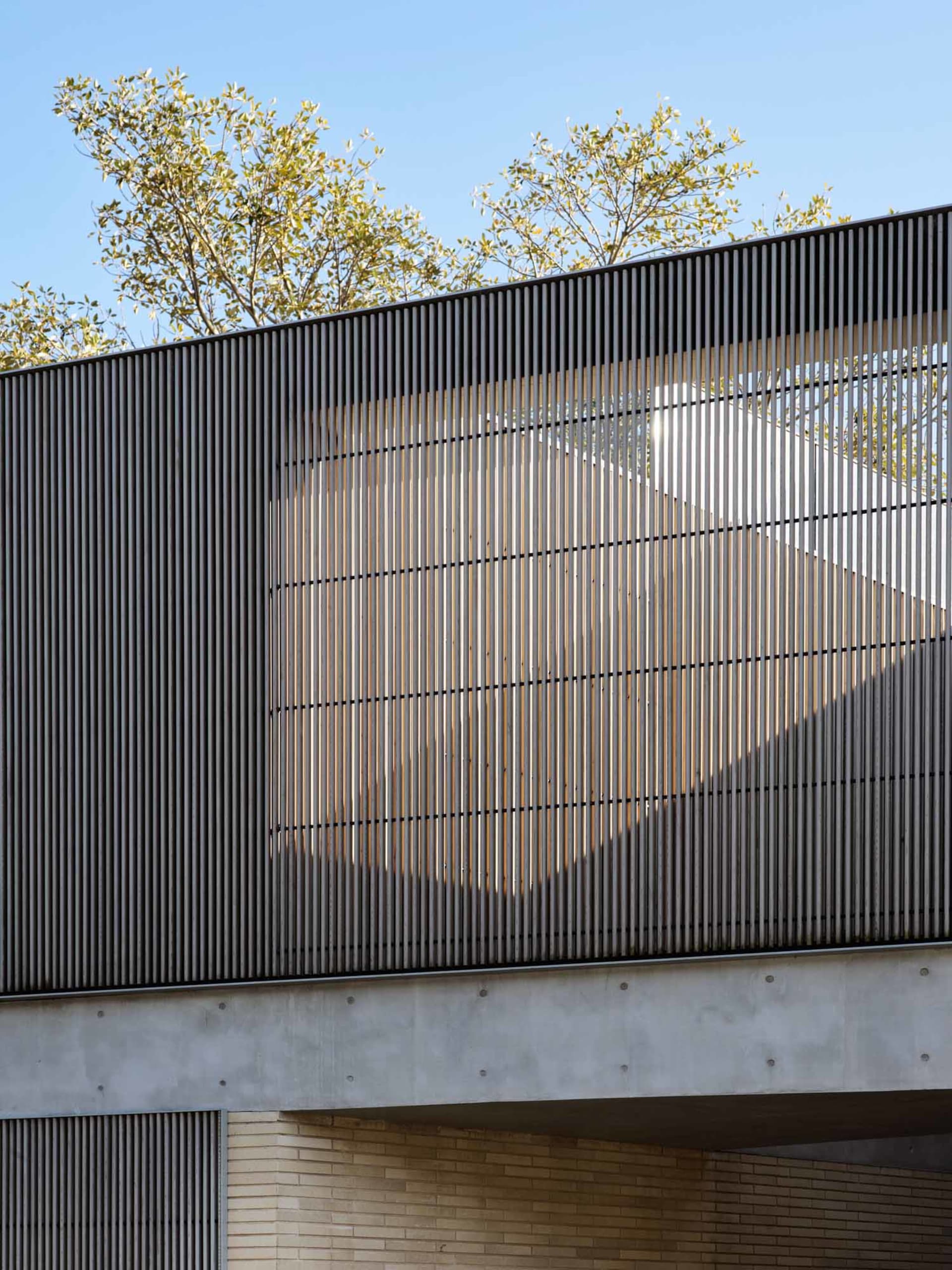 Modern architectural facade featuring a metal screen design.