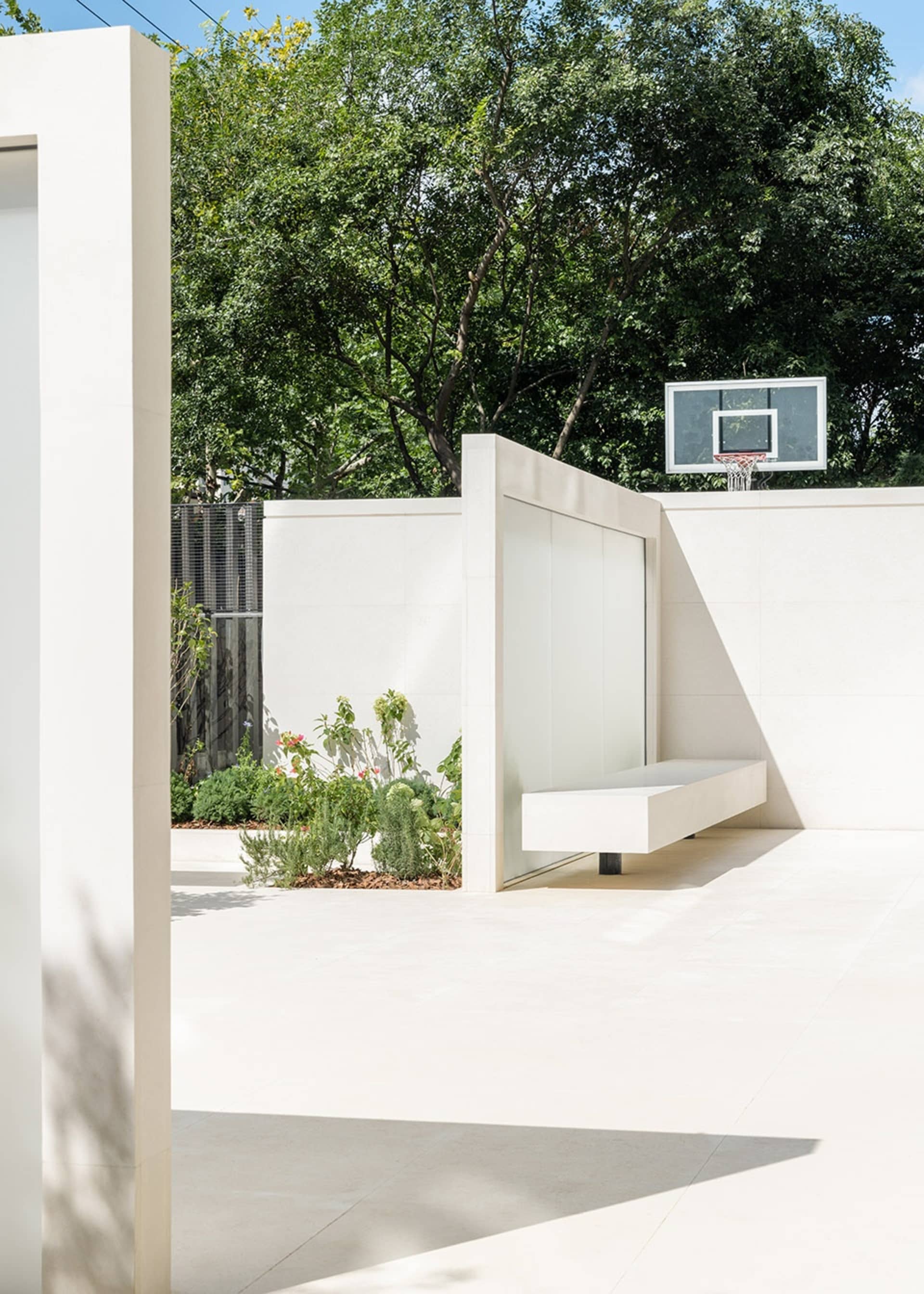 Modern swimming pool house featuring minimalist white concrete architecture