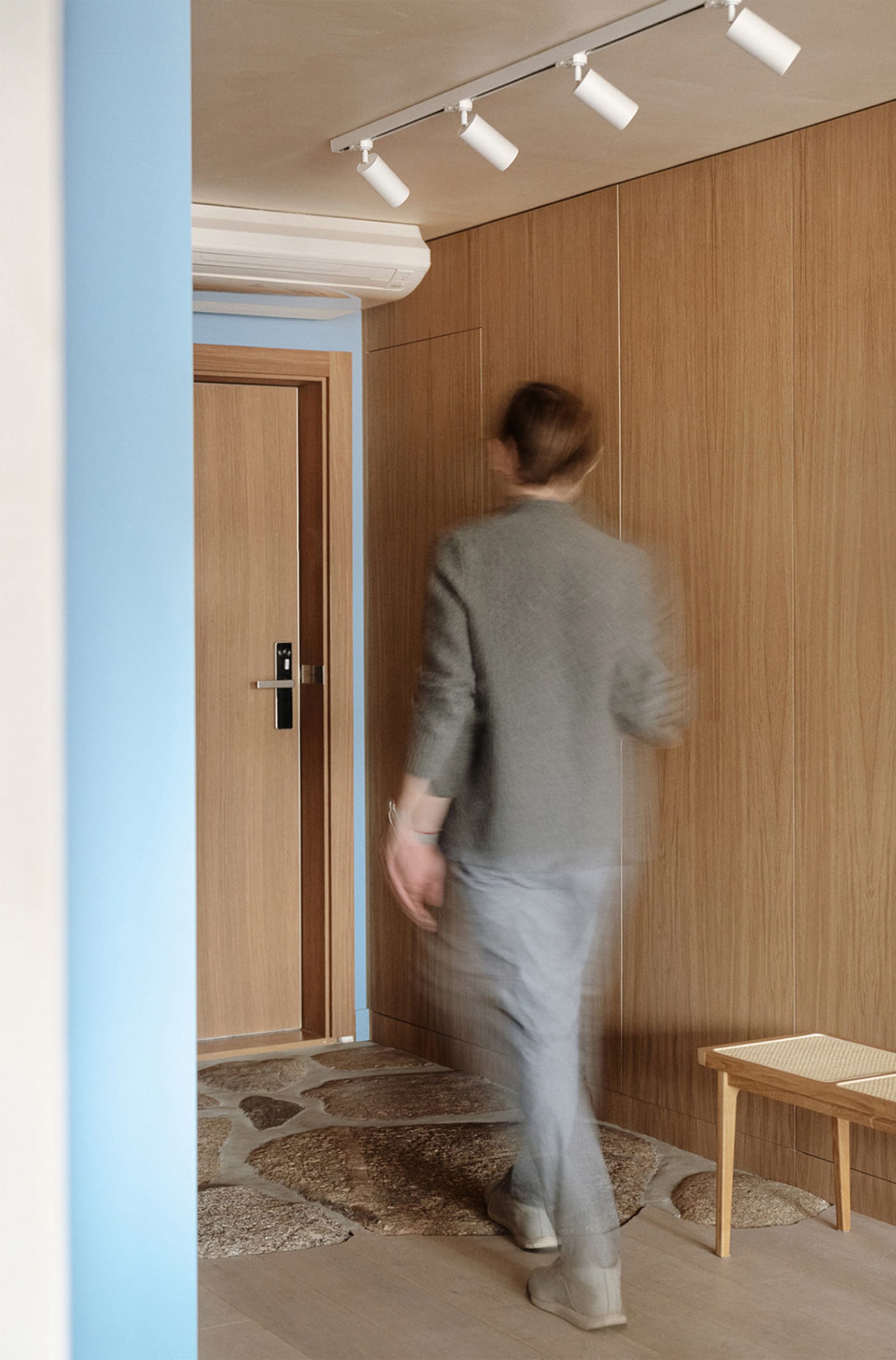 A minimalist interior featuring wood paneling.