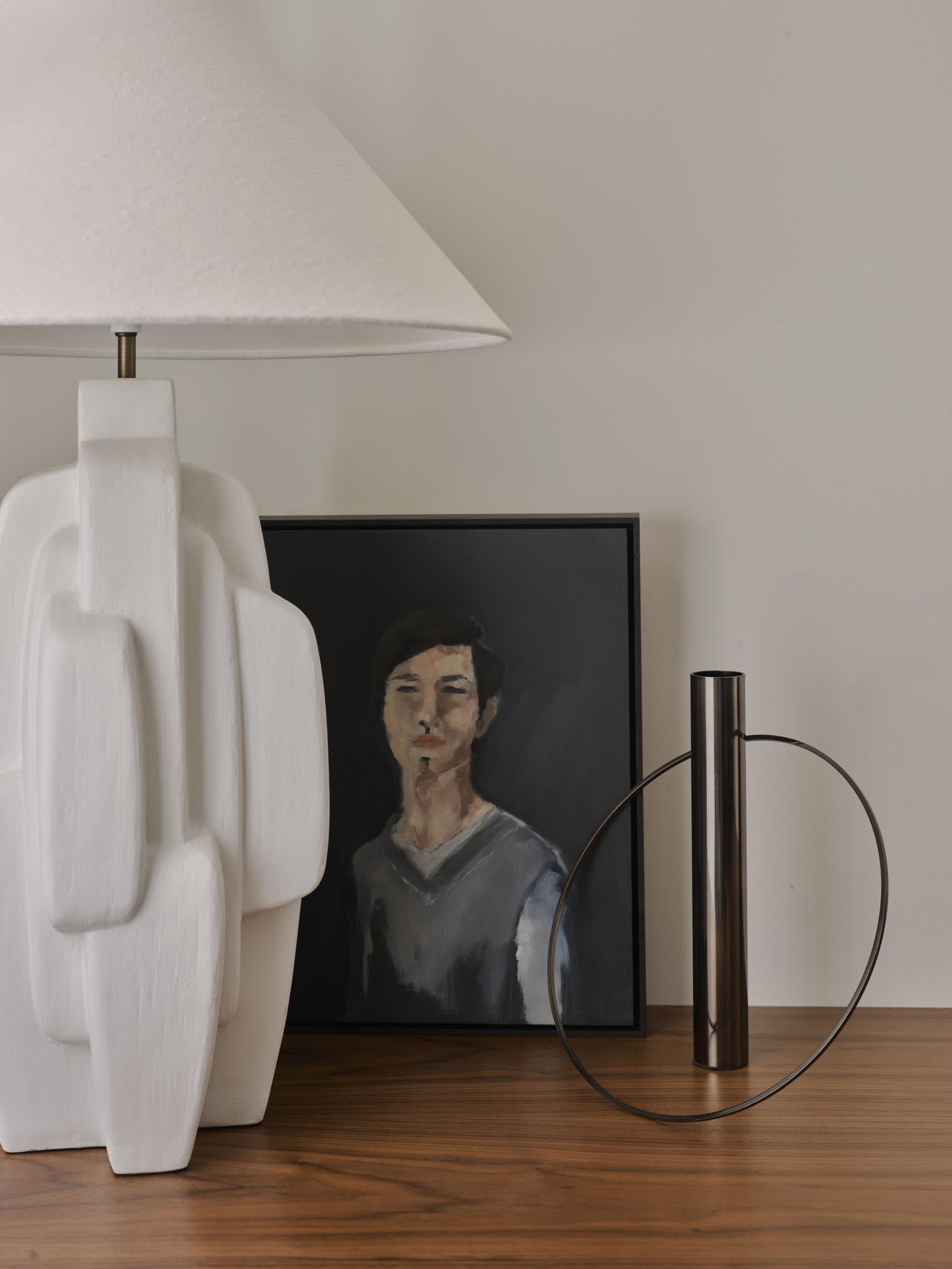 Portrait painting featuring a person on a black background.