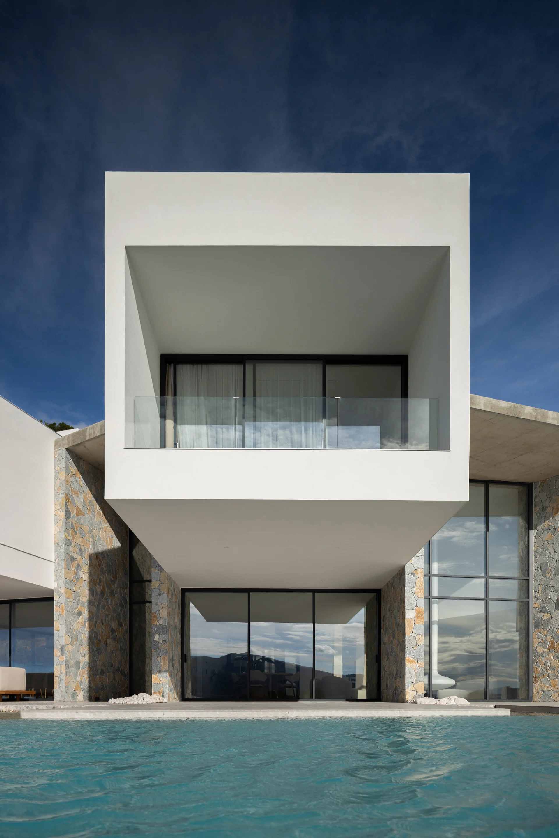 Modern residential architecture with concrete and glass materials.
