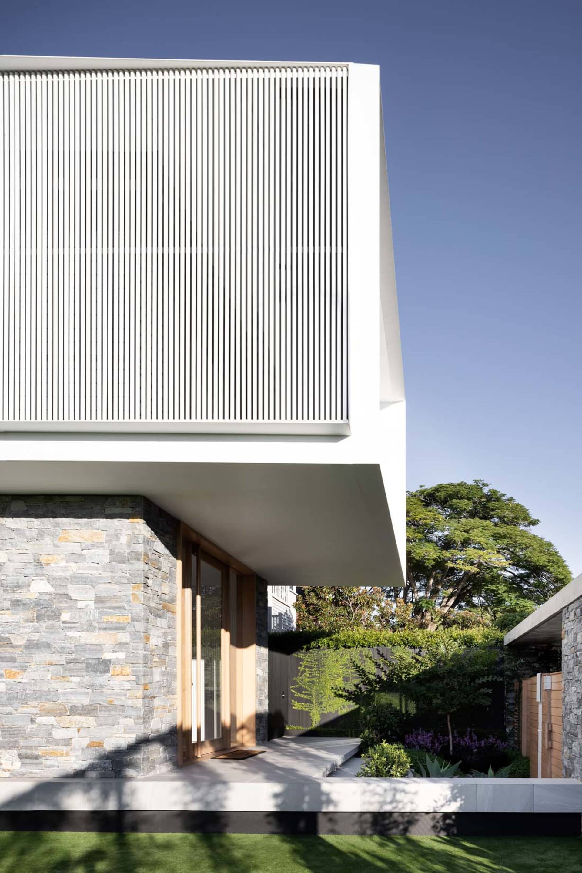 Modern house exterior with stone and metal accents