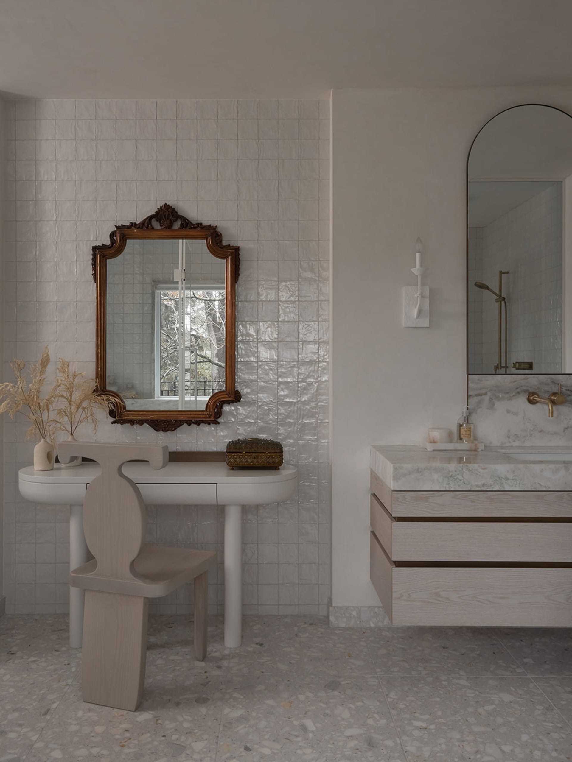 Modern bathroom with terrazzo floor, white walls, and minimalist design.