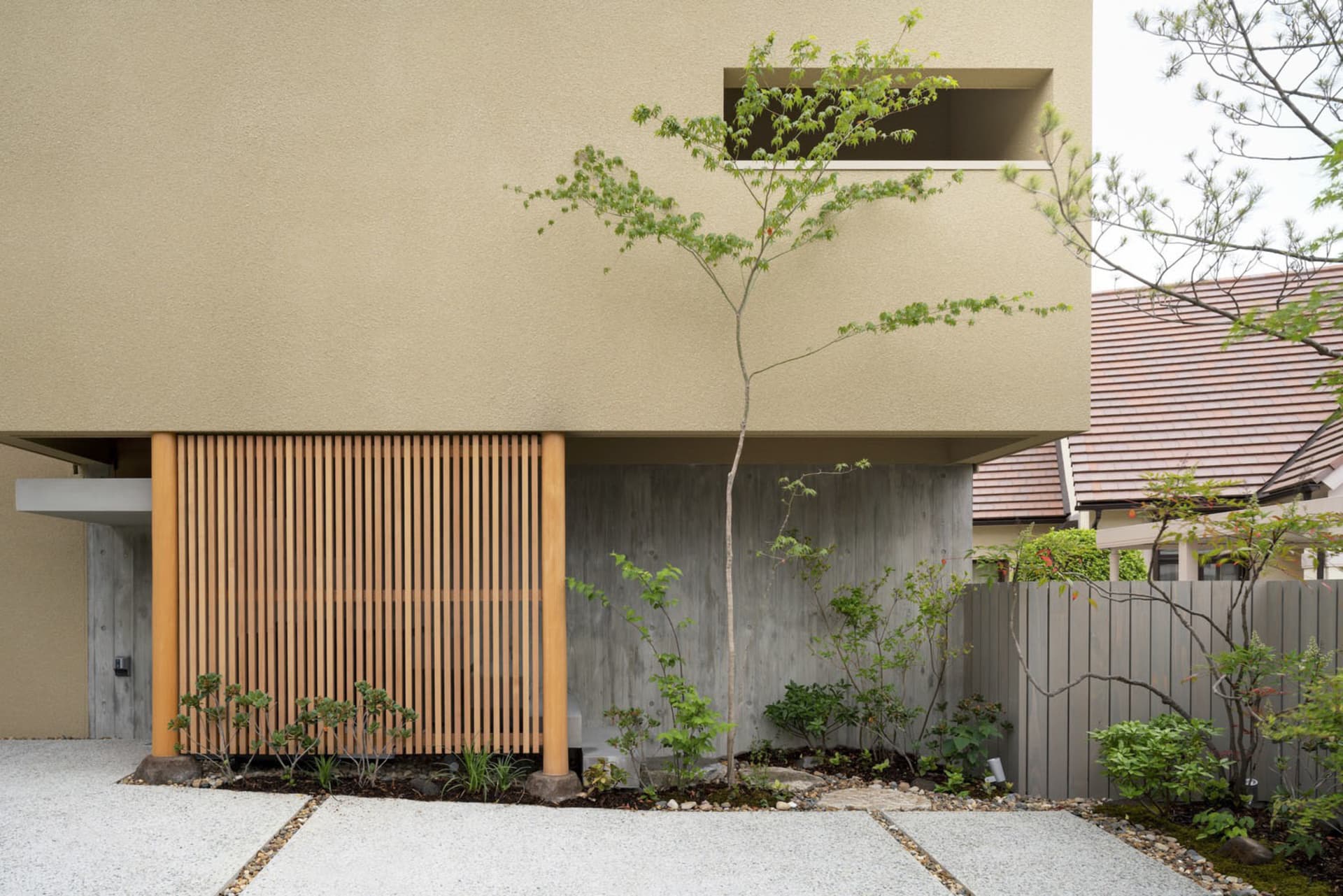 Modern house exterior featuring wooden slats and concrete