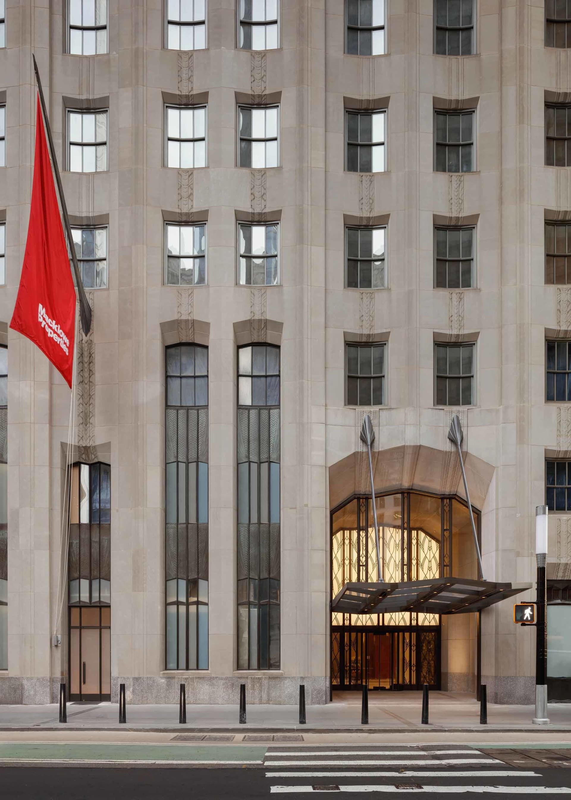 Concrete and glass entryway of an office building.