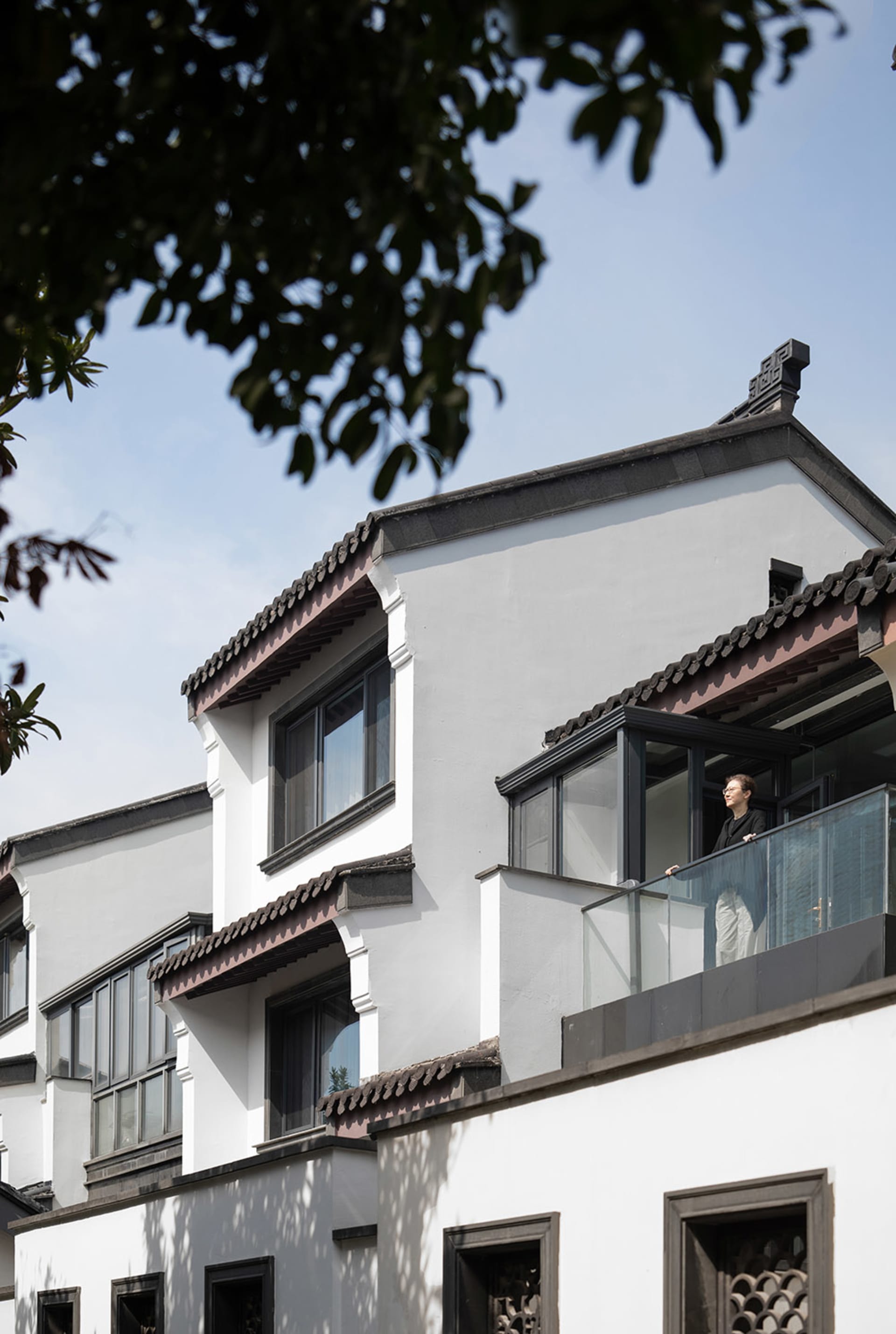 A modern building with white-painted stone construction.
