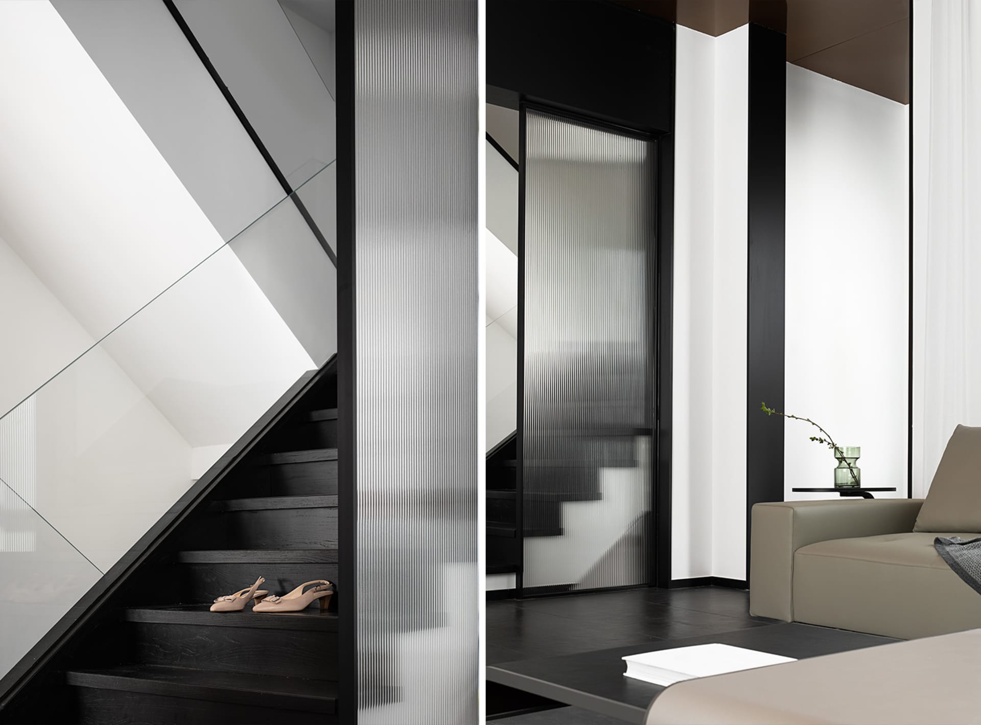 A modern living room with glass walls and black wooden flooring.