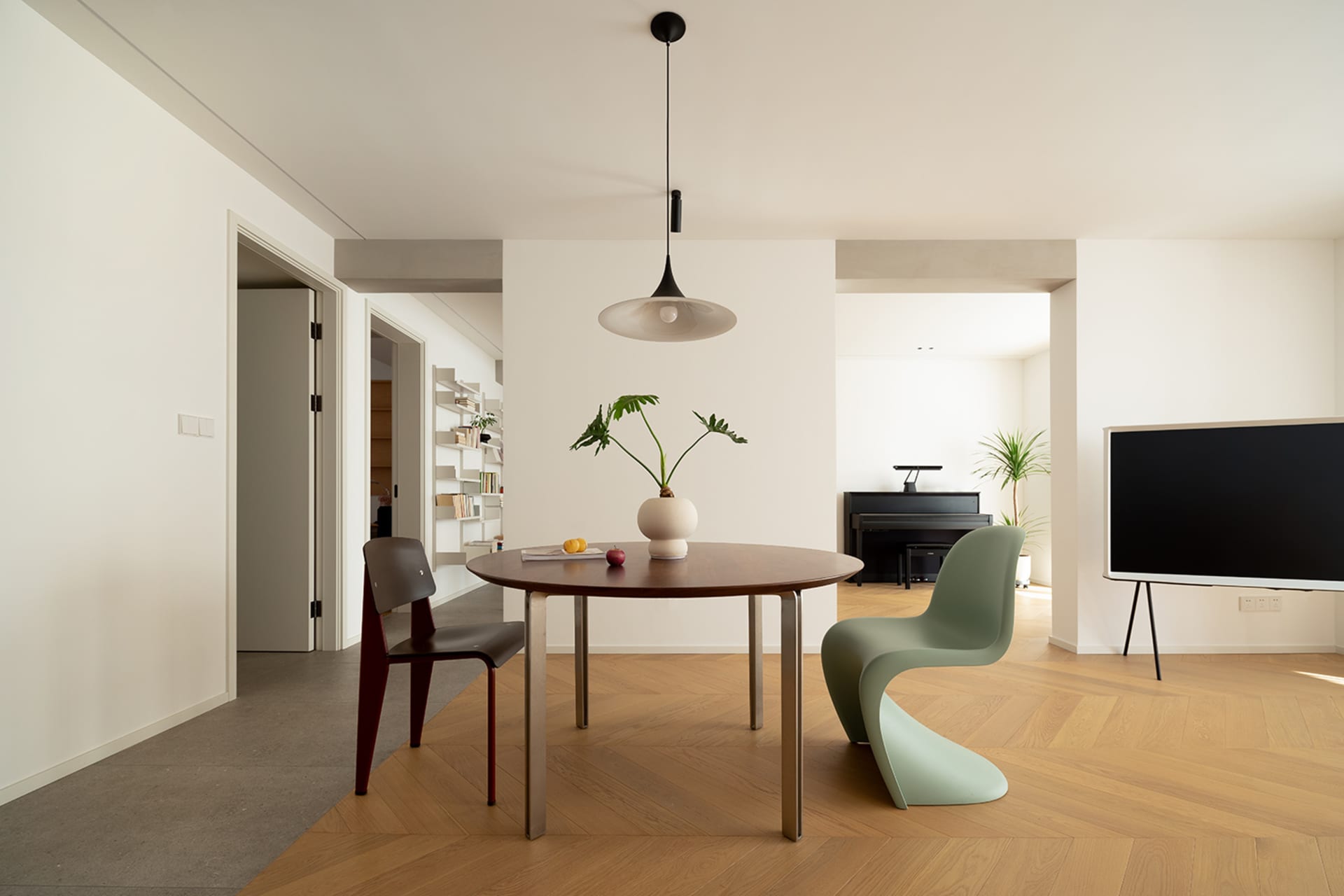 An industrial-style residential space featuring hardwood flooring, concrete accents, and metal elements.