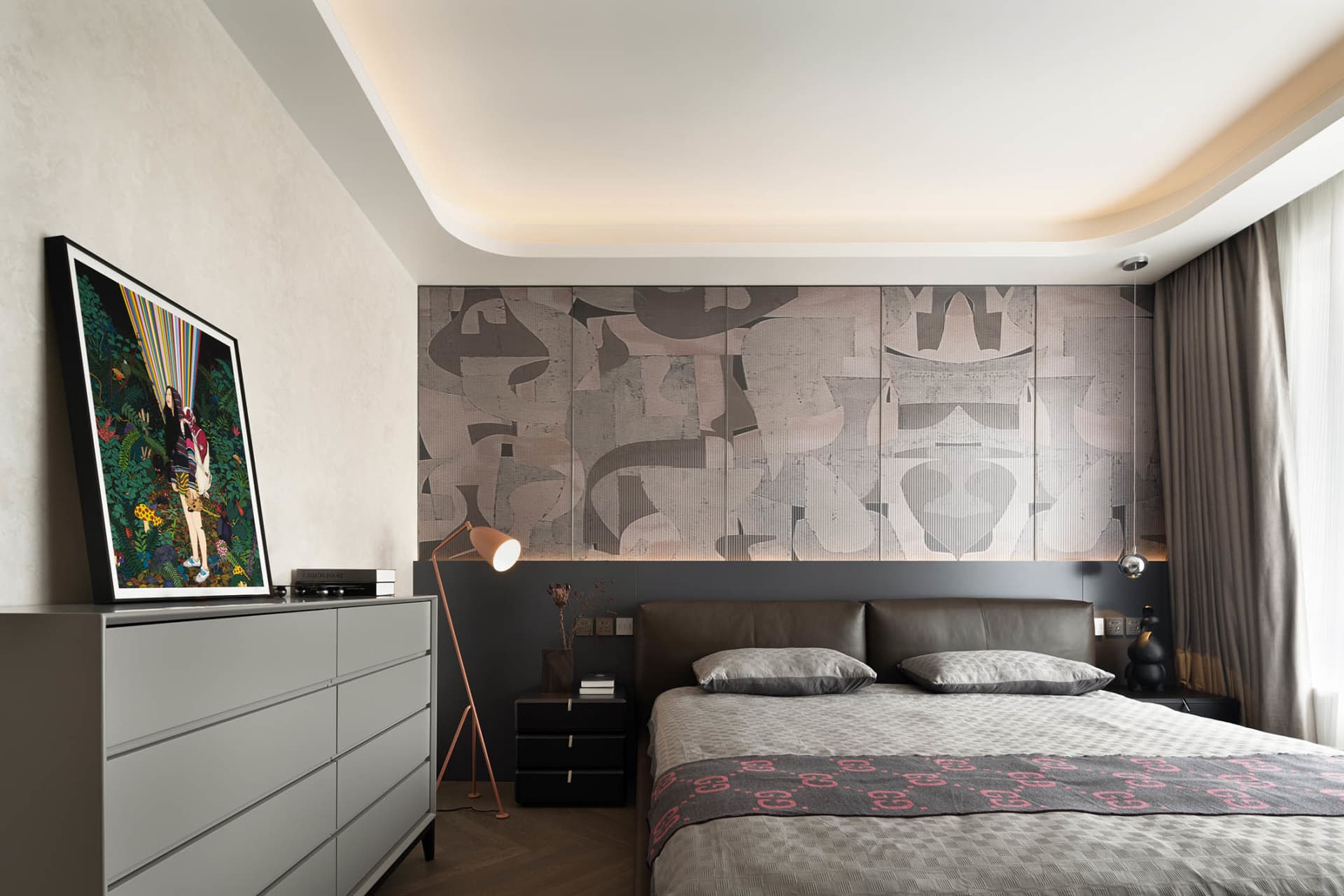 Modern bedroom with neutral tones and abstract wall design