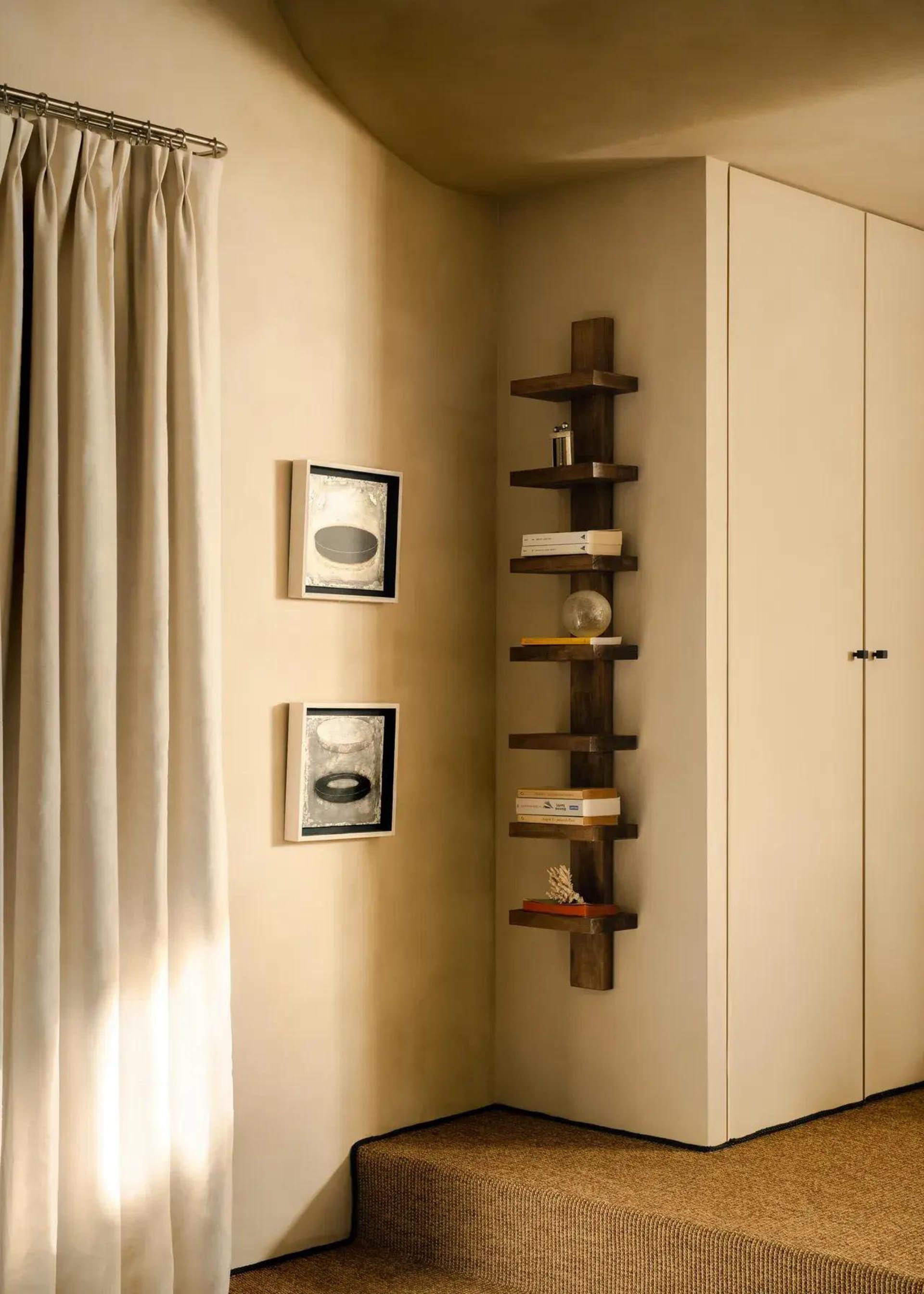 A modern home library featuring a wooden vertical shelf for storage