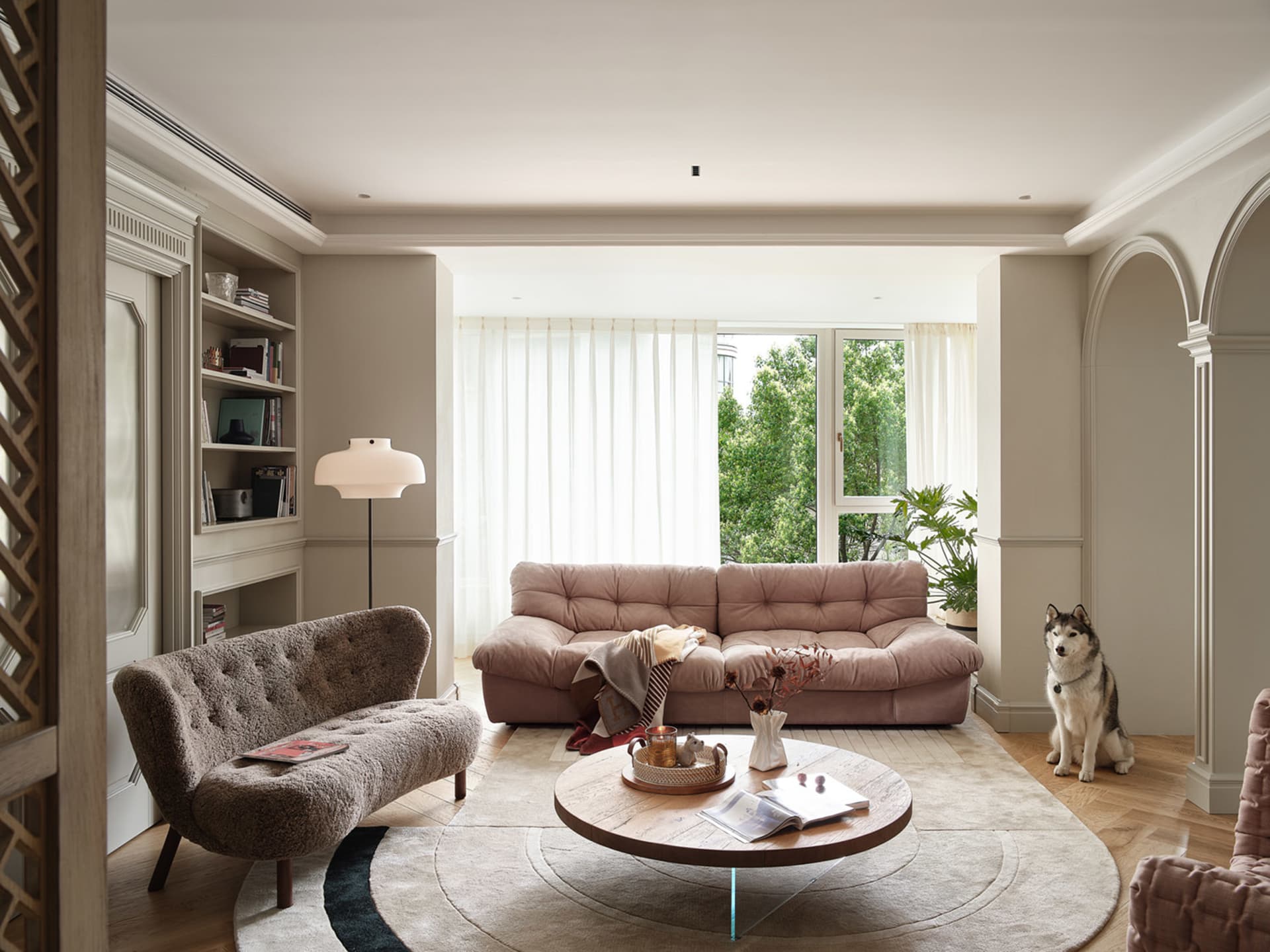 Modern living room with fabric sofa, wooden coffee table, and leather accents.