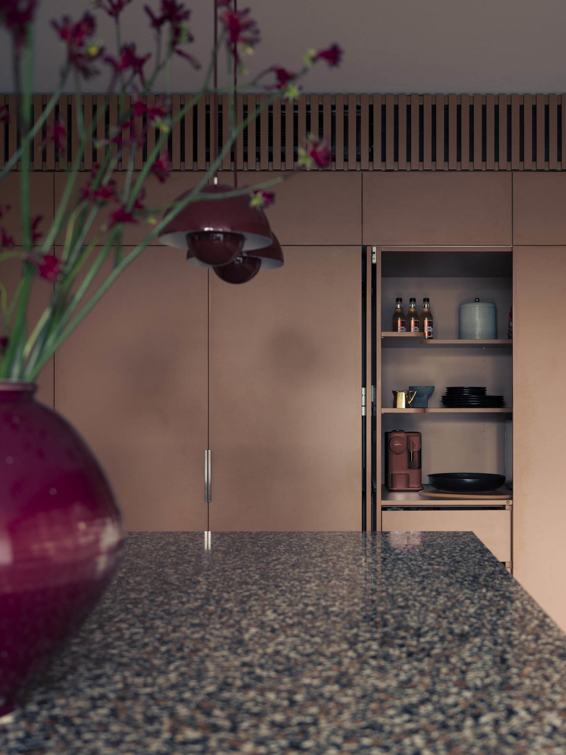 Modern residential kitchen featuring granite countertops, minimalist design, and sleek cabinetry.