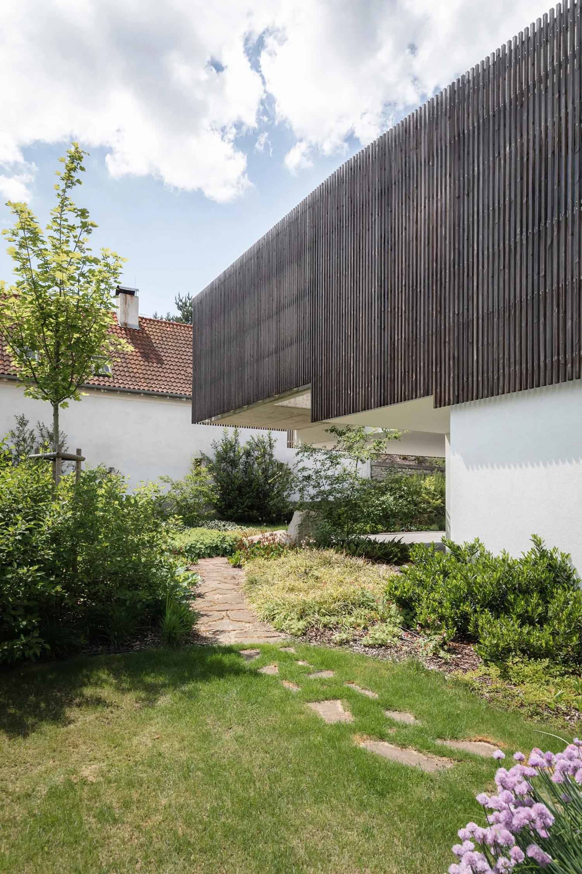 A modern house exterior featuring wooden panels