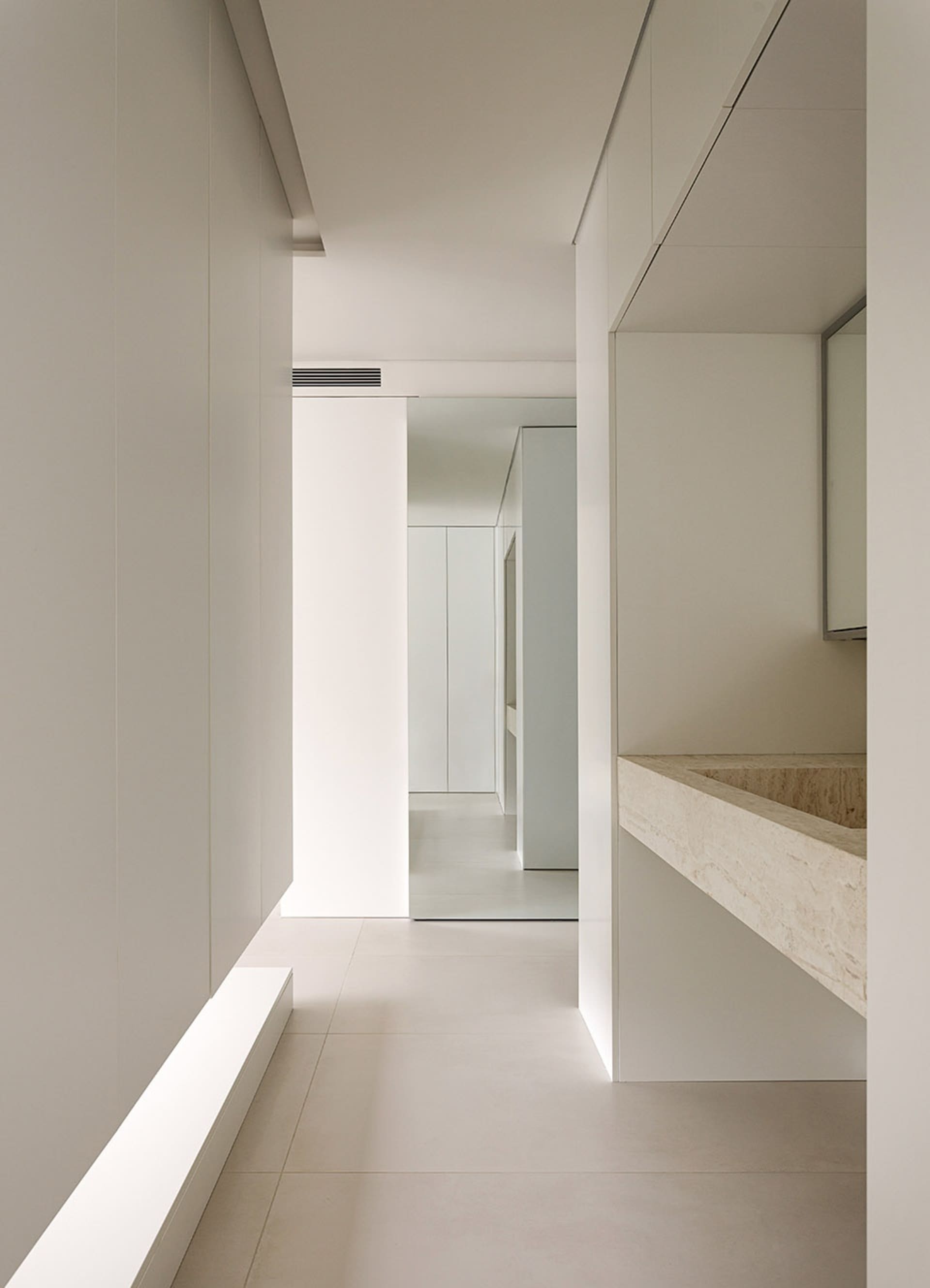 Modern minimalist interior design featuring marble elements.