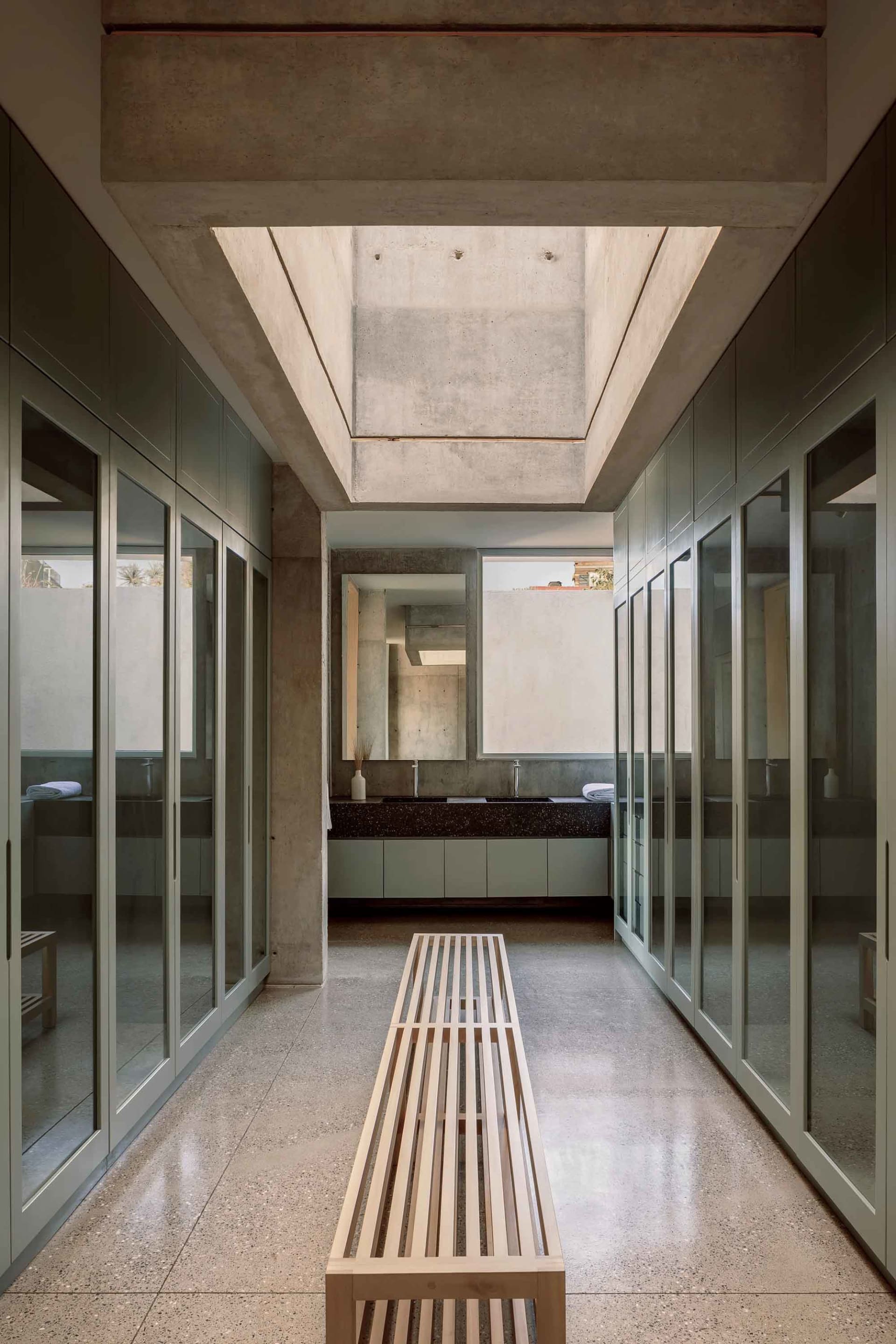 Modern bathroom with concrete and glass elements