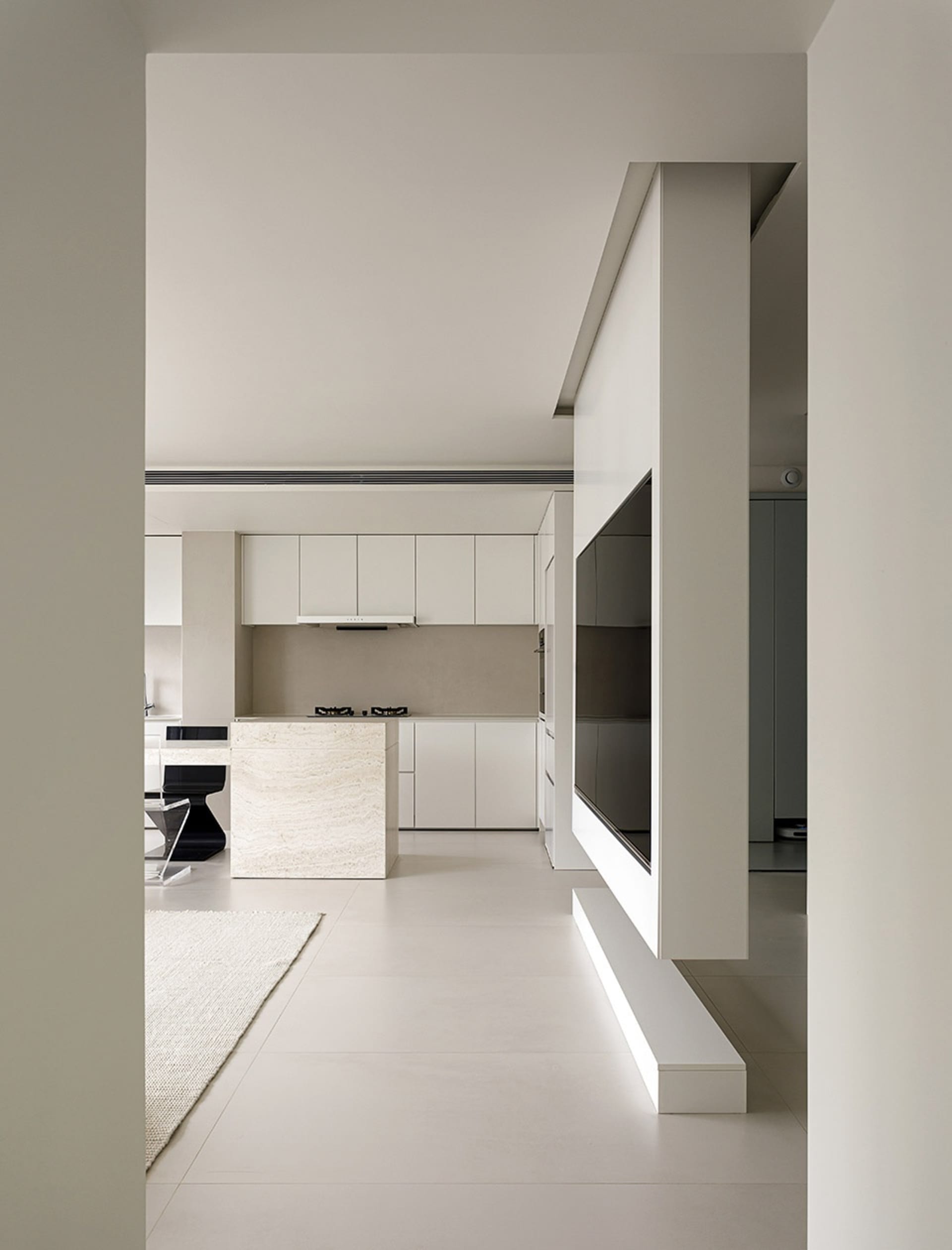 Modern kitchen with white marble island and white cabinets