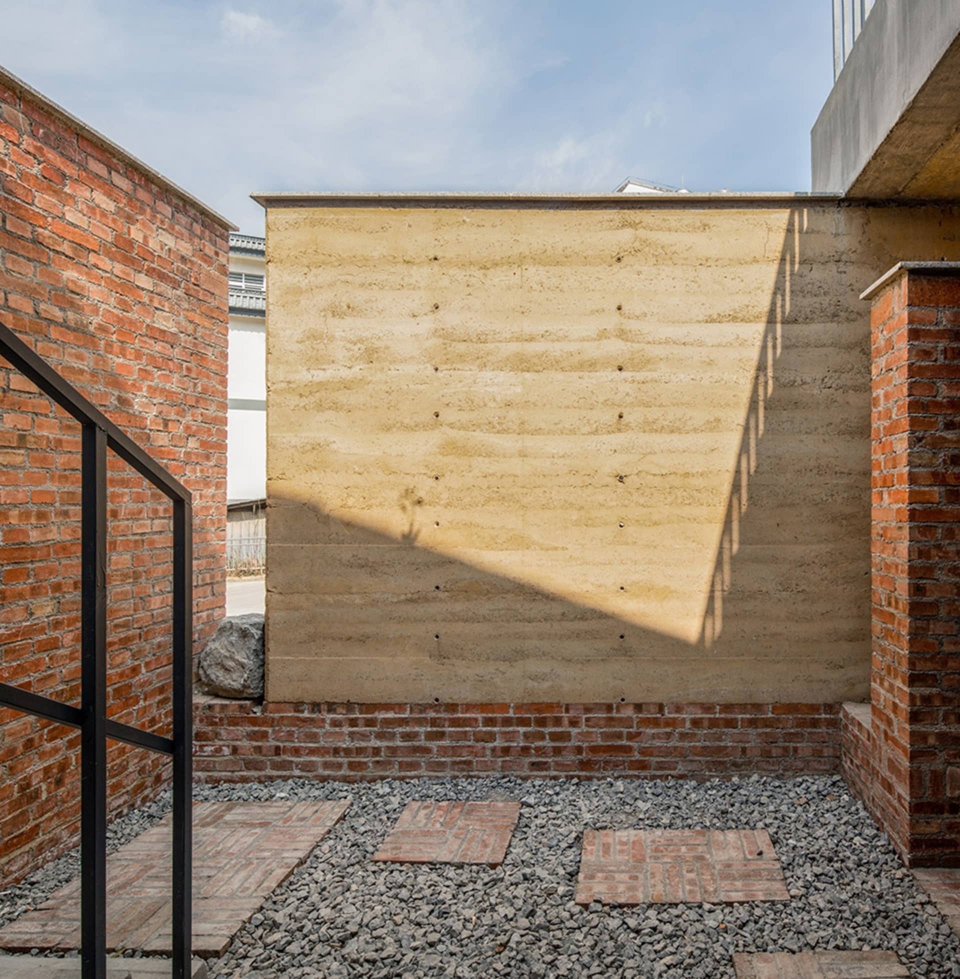 Concrete exterior walls with shadows in a modern architectural design.