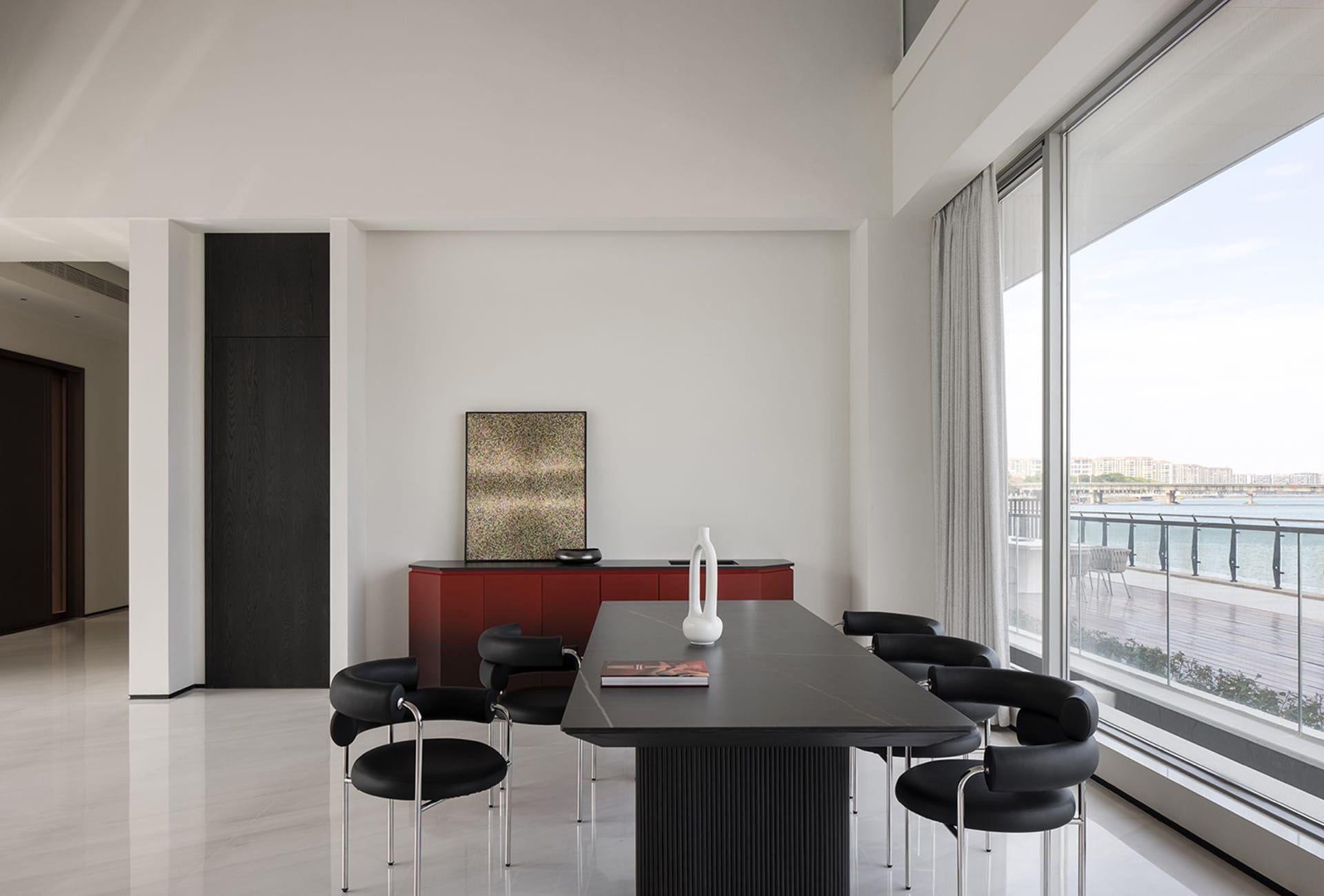 A modern residential interior with metal, glass, and ceramic materials.