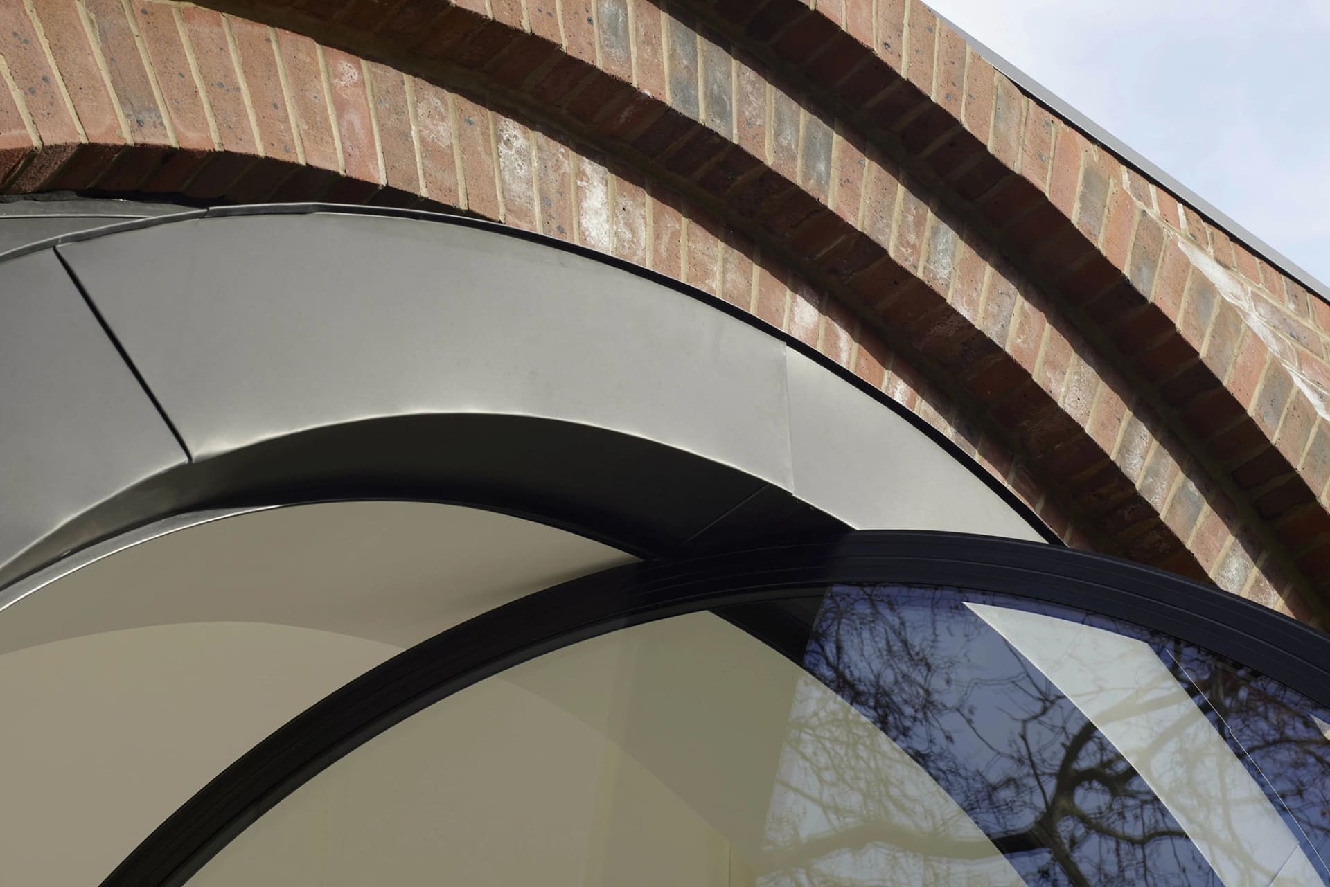 Modern architectural design with brick and glass material.