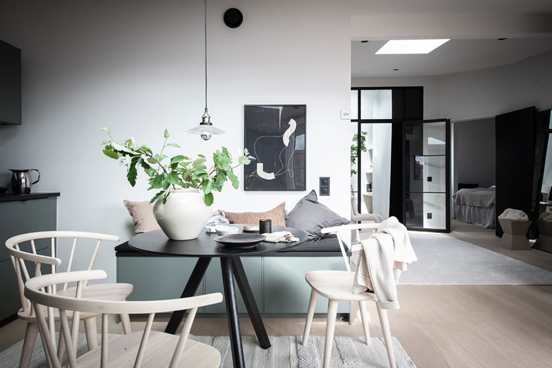 Modern dining room with white furniture and minimalist decor