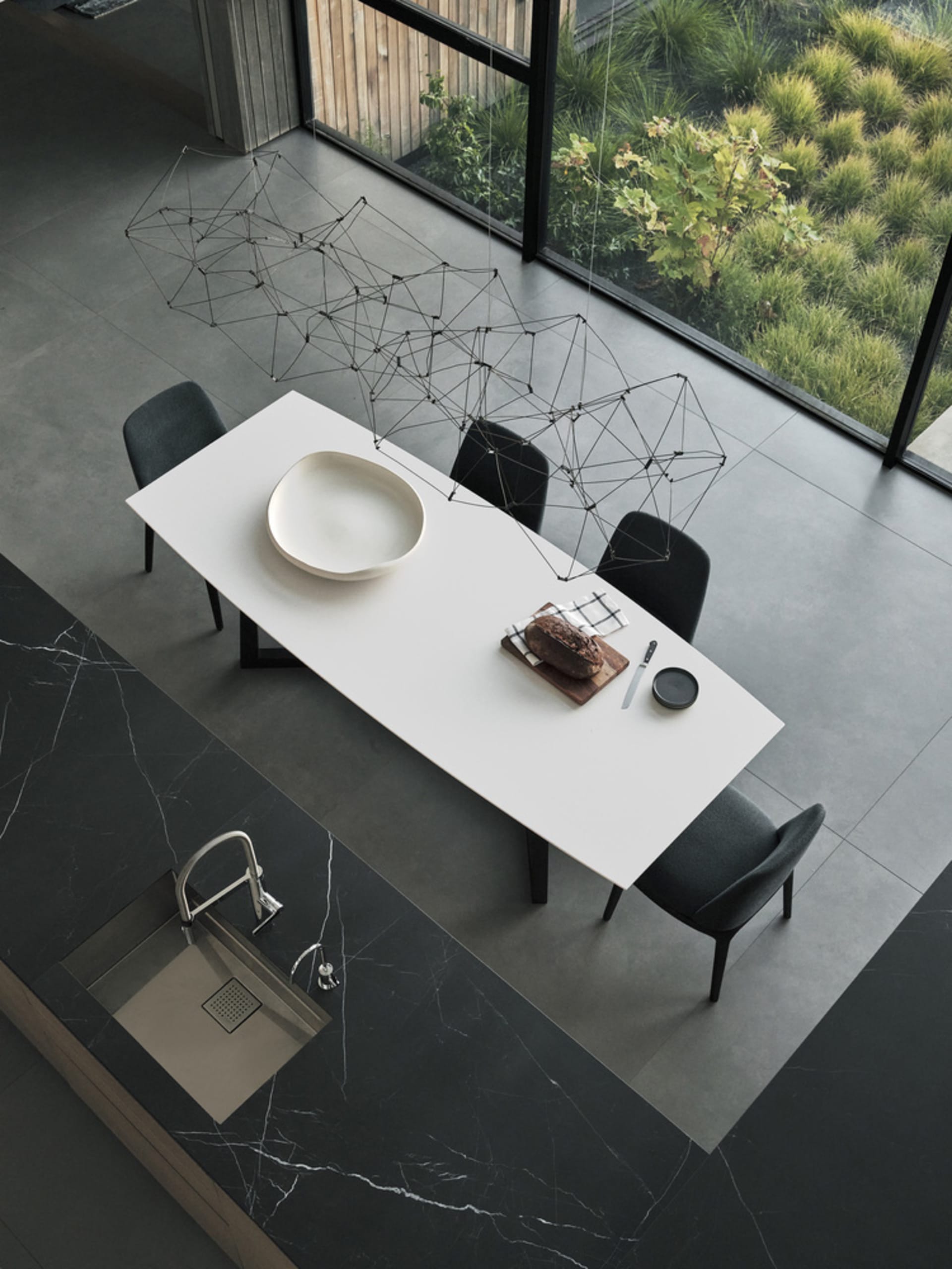 Modern kitchen with concrete countertop and wooden accents